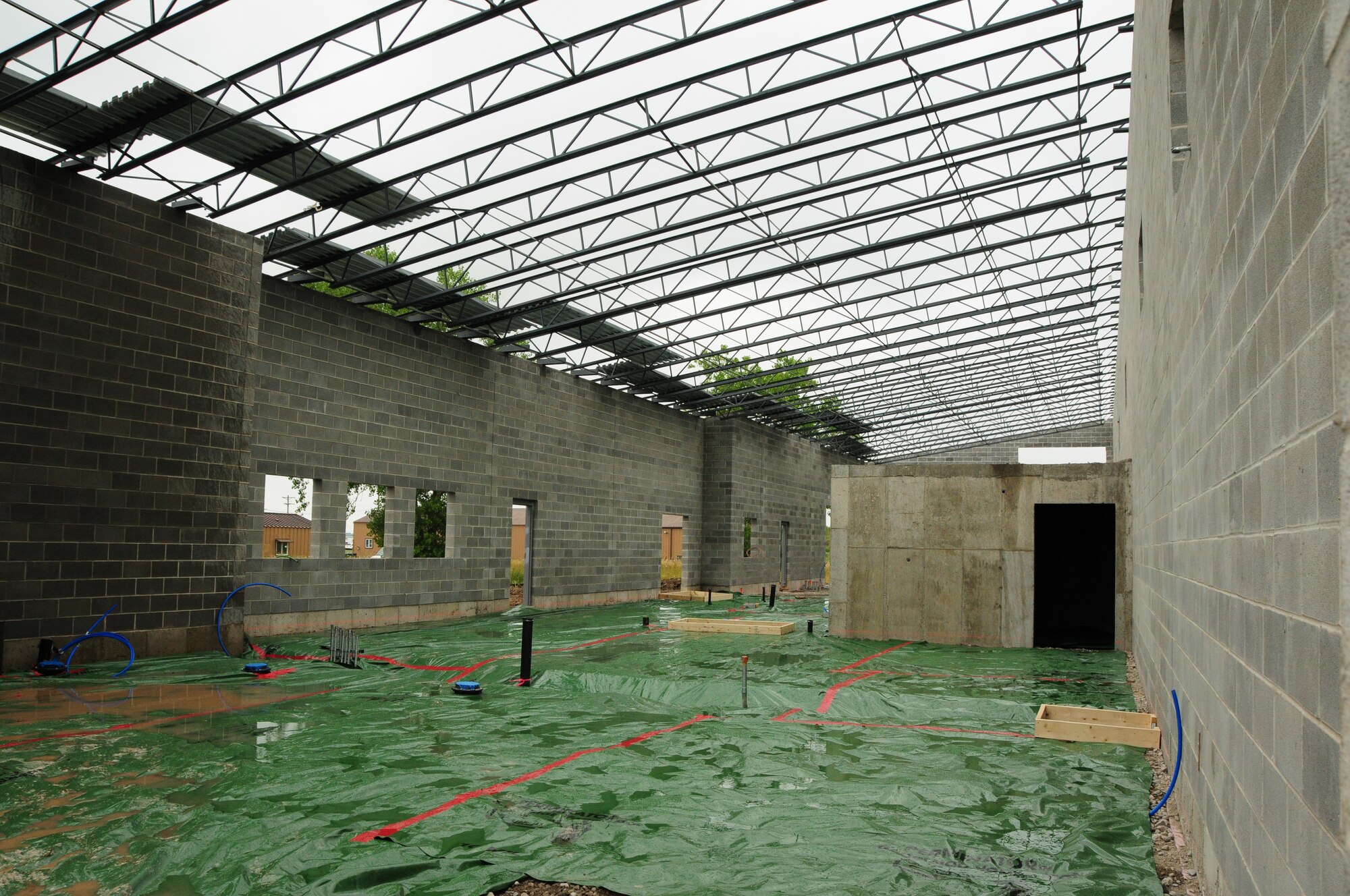 Indoor firing range construction progresses at Niagara Falls Air Reserve Station, N.Y. on August 3, 2011. This 6.3 million dollar 21,000 square foot facility will be utilized by several units stationed at the base in addition to other local, state and federal law enforcement agencies. (U.S. Air Force photo by Peter Borys)