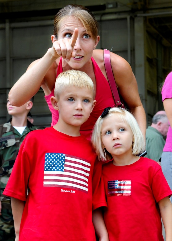 Steven and Lillian Olson look for their father's aircraft at Duke Field Aug. 7.  The aircraft, a C-130E Combat Talon I, returned Capt. Michael Olson of the 711th Special Operations Wing and more than 25 other Air Force Reserve Airmen to their families.  (U.S. Air Force photo/Tech. Sgt. Cheryl Foster)