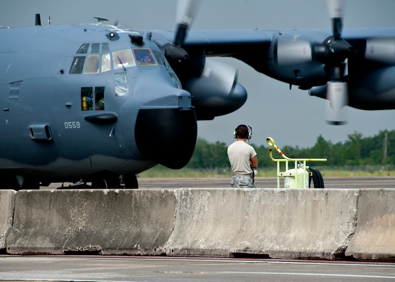 A 919th Special Operations Wing maintainer watches as an MC-130 Combat Talon I pulls into its parking spot after returning from a deployment Aug. 7 at Duke Field, Fla.  (U.S. Air Force photo/Tech. Sgt. Samuel King Jr.)