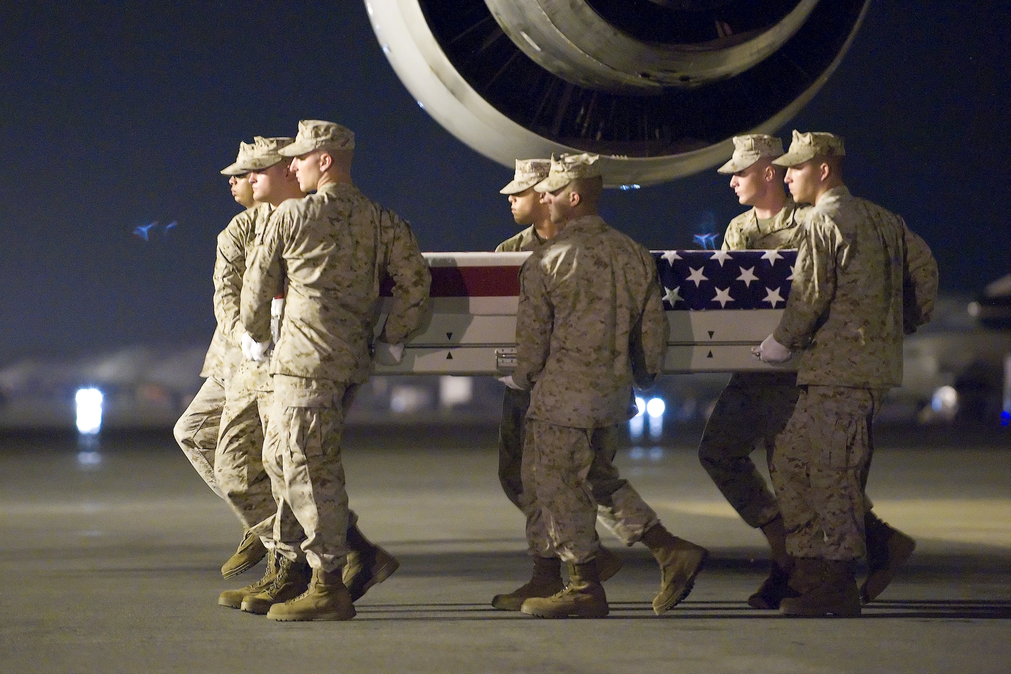 A U.S. Marine Corps carry team transfers the remains of Marine Sgt. Daniel Patron, at Dover Air Force Base, Del., Aug. 8, 2011. Patron was assigned to 8th Engineer Support Battalion, 2nd Marine Logistics Group, II Marine Expeditionary Force, Camp Lejeune, N.C.  (U.S. Air Force photo/Steve Kotecki)