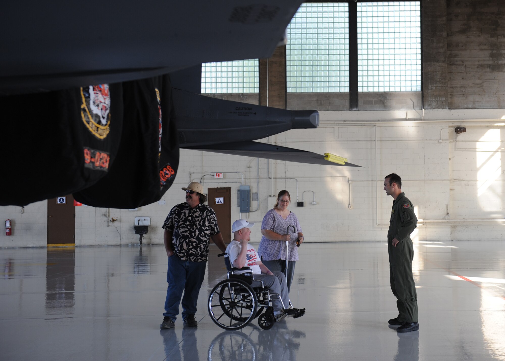 MOUNTAIN HOME AIR FORCE BASE, Idaho – Christopher McClaskey, and his parents Cindy and Mark, receive a tour of the F-15E Strike Eagle by Capt. Jeffrey Iannaccone, 391st Fighter Squadron pilot, here. Christopher, who has always hoped to become an Air Force fighter pilot, was disqualified from joining the military due to his neurofibromatosis, which causes tumors to grow on nerve endings. (U.S. Air Force photo by Staff Sgt. Gina Chiaverotti-Paige)