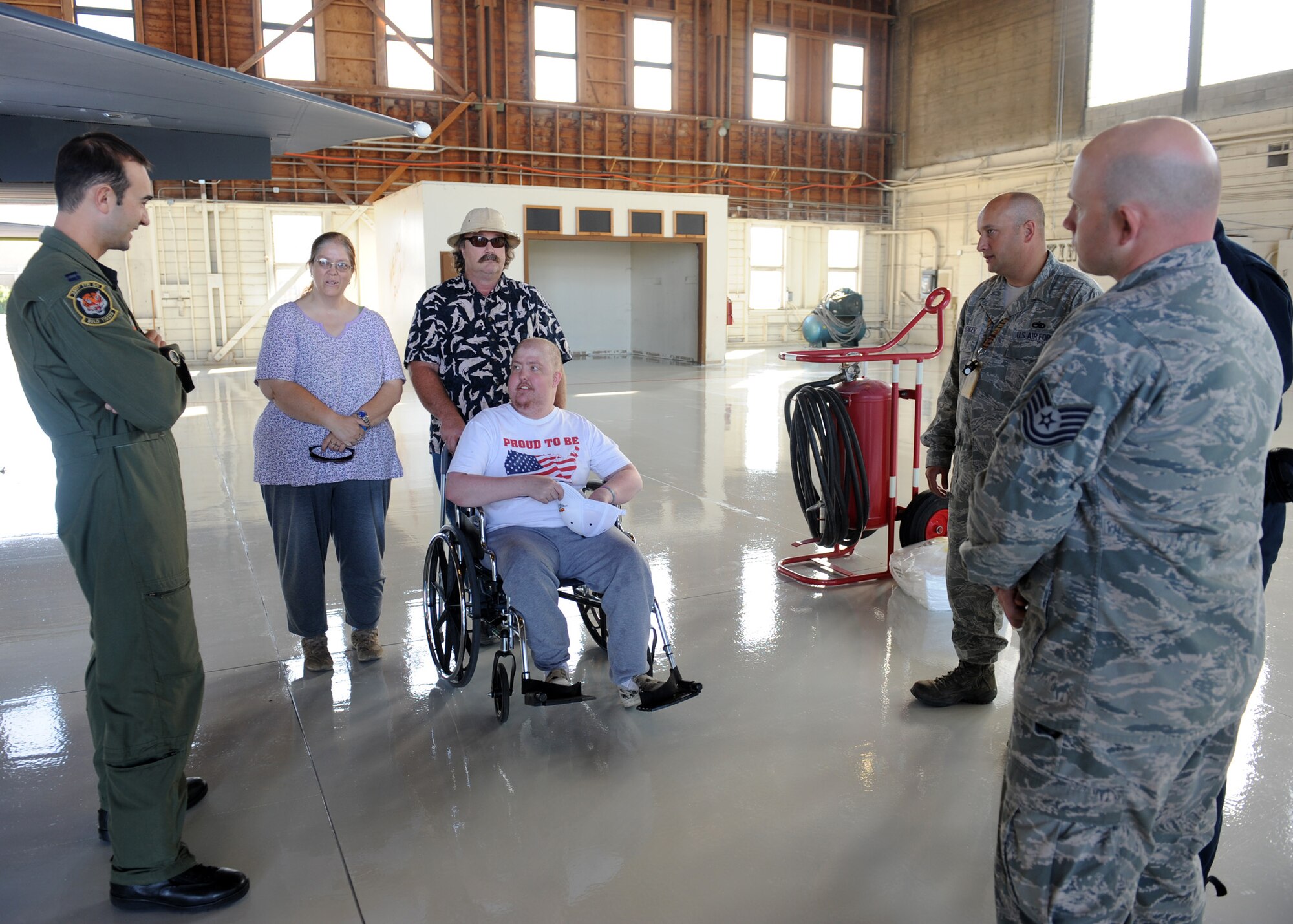 MOUNTAIN HOME AIR FORCE BASE, Idaho – Christopher McClaskey, 23, speaks to a 391st Fighter Squadron F-15E pilot, crew chiefs and maintainers about the F-15E Strike Eagle here. Christopher, who has terminal brain cancer, received a tour of the aircraft, squadron, and a ride in an F-15E simulator. (U.S. Air Force photo by Staff Sgt. Gina Chiaverotti-Paige)