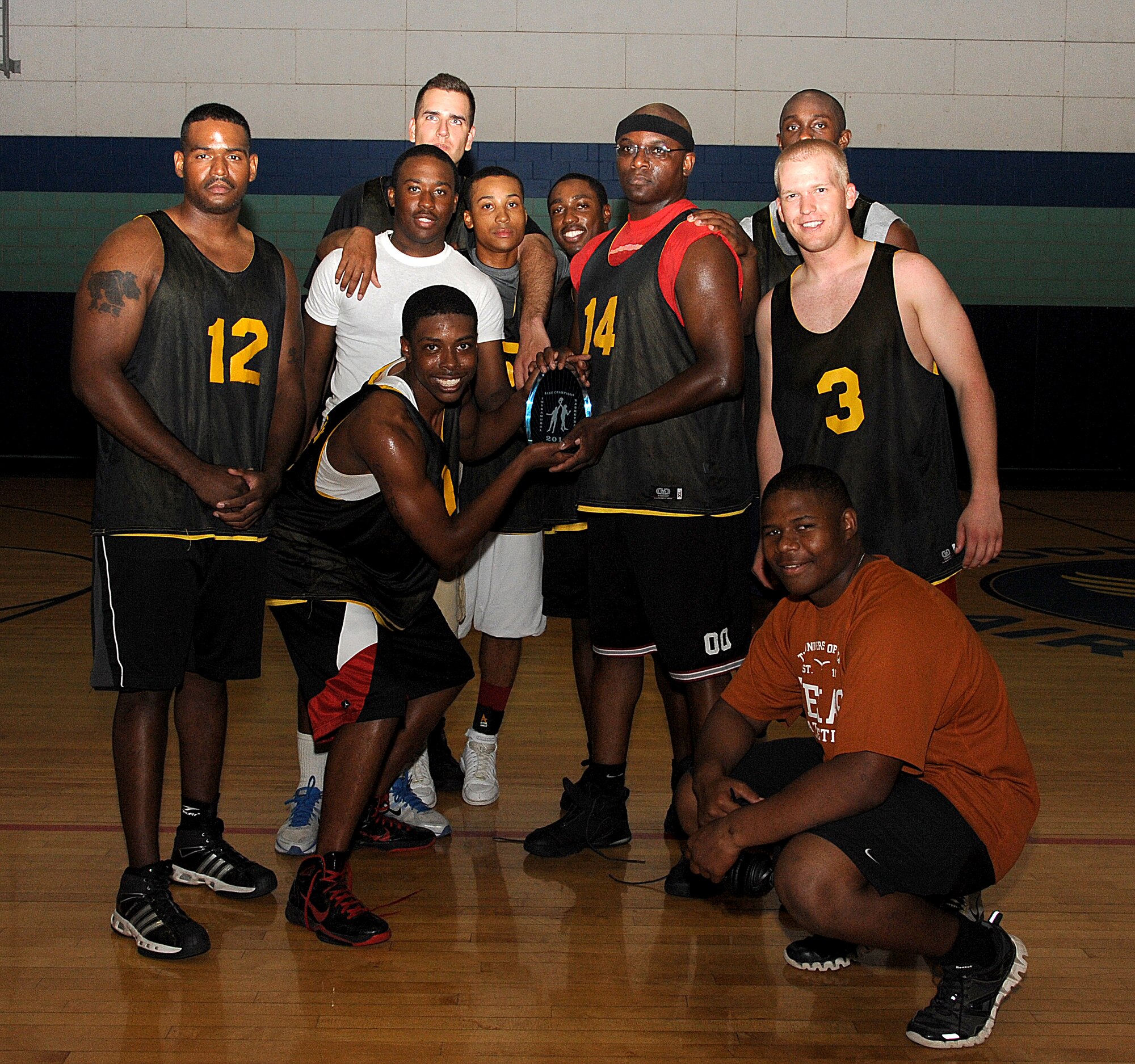 GOODFELLOW AIR FORCE BASE, Texas -- The 344th Military Intelligence Battalion team show off their new trophy Aug. 4 after defeating the 315th Training Squadron, 48-37, taking the 2011 Intramural Basketball Championship. (U.S. Air Force photo/Airman 1st Class Michael Smith)