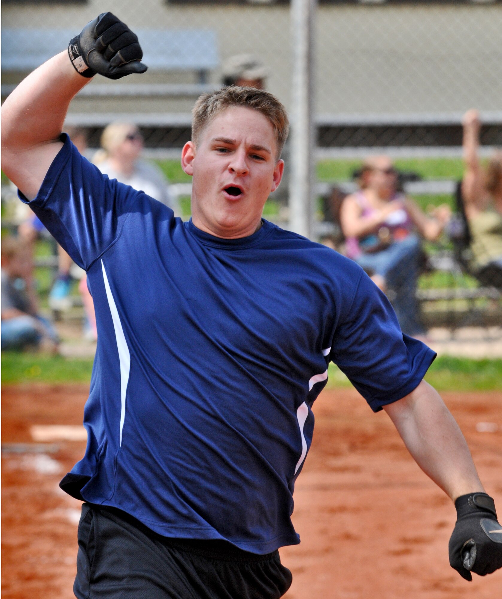 SPANGDAHLEM AIR BASE, Germany -- Matthew Jacka, 606th Air Control Squadron Galley Warriors, celebrates after hitting the game winning home run during a U.S. Air Forces in Europe Small Units Softball Tournament game against the Royal Air Force Croughton Cougars here Aug. 4. The 726th Air Mobility Squadron won the tournament or out the seven teams from across Europe that competed. (U.S. Air Force photo/Senior Airman Nick Wilson)