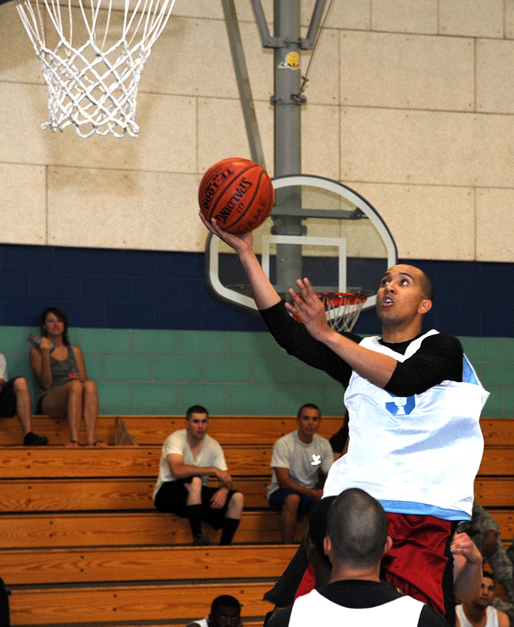 GOODFELLOW AIR FORCE BASE, Texas -- Tory Donato, 315th Training Squadron, goes for a layup during the Intramural Basketball Championship game against the 344th Military Intelligence Battalion Aug. 4. The 344th MIB defeated the Rattlers, 48-37, taking the 2011 championship. (U.S. Air Force photo/Airman 1st Class Michael Smith)