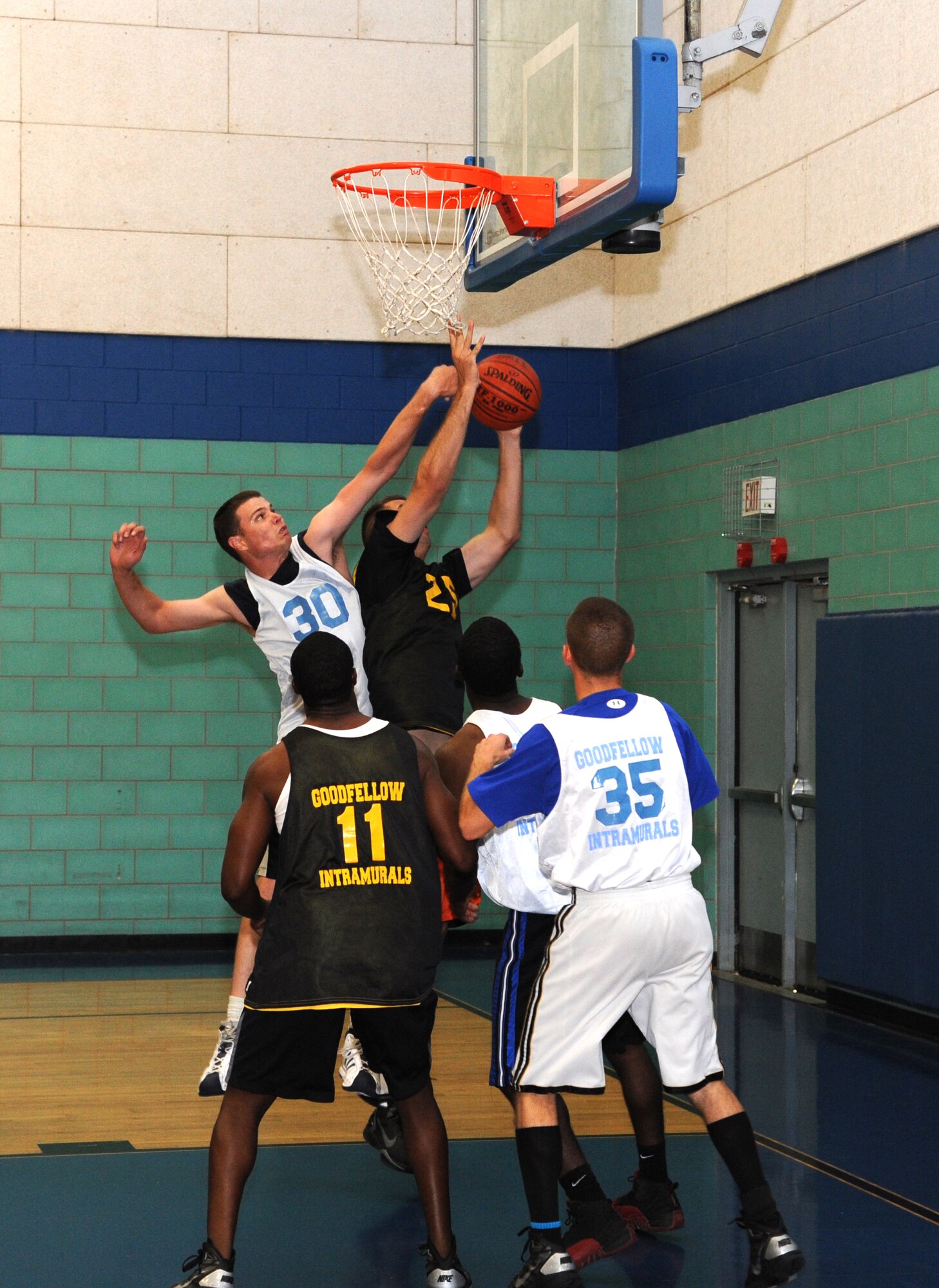 GOODFELLOW AIR FORCE BASE, Texas – Going toe to toe, 315th Training Squadron Rattlers try to block a 344th Military Intelligence Battalion shot during the intramural basketball championship game Aug. 4.  The 344th MIB defeated the Rattlers, 48-37, taking the 2011 championship. (U.S. Air Force photo/Airman 1st Class Michael Smith)