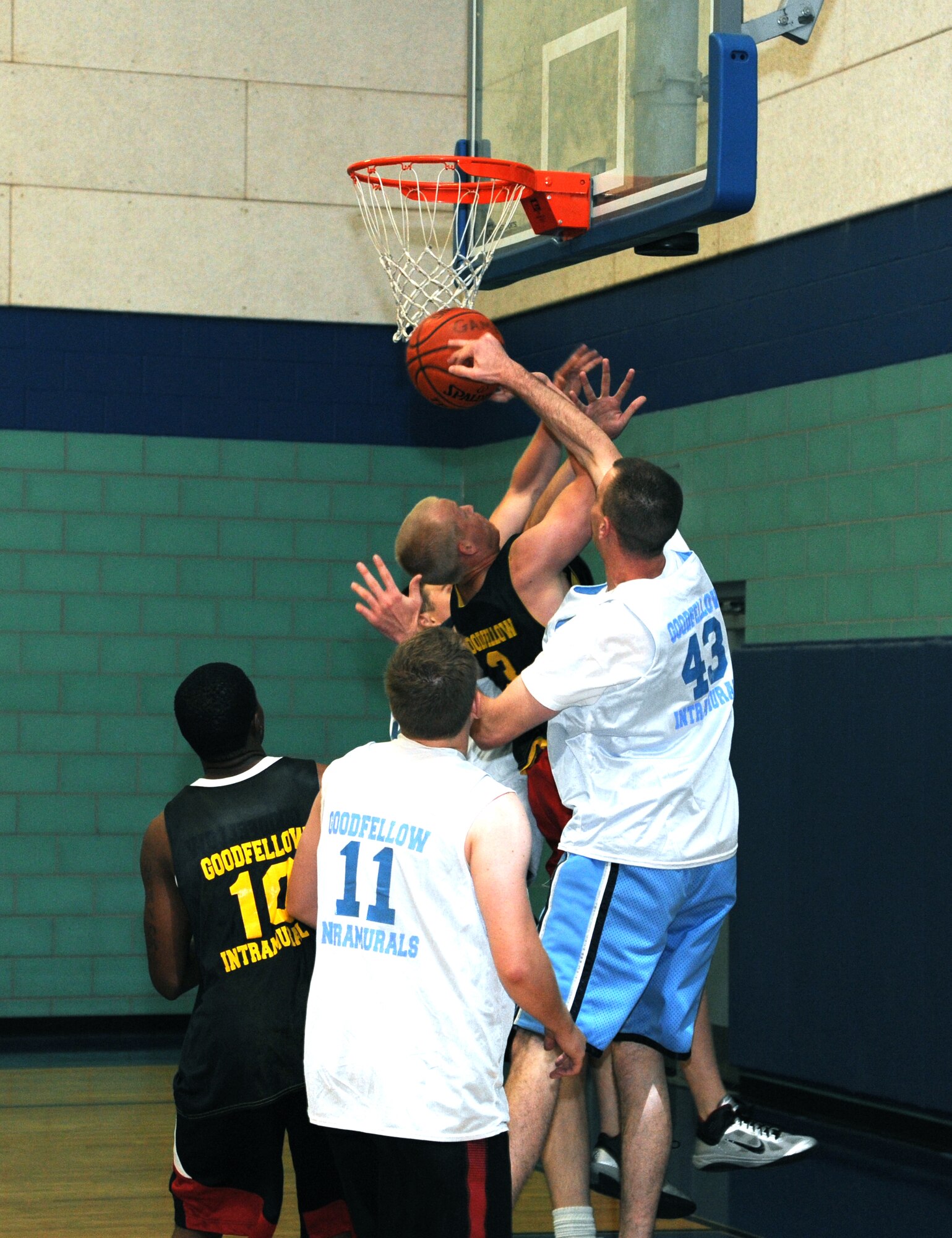 GOODFELLOW AIR FORCE BASE, Texas – Going toe to toe, 315th Training Squadron Rattlers try to block a 344th Military Intelligence Battalion shot during the intramural basketball championship game Aug. 4.  The 344th MIB defeated the Rattlers, 48-37, taking the 2011 championship. (U.S. Air Force photo/Airman 1st Class Michael Smith)