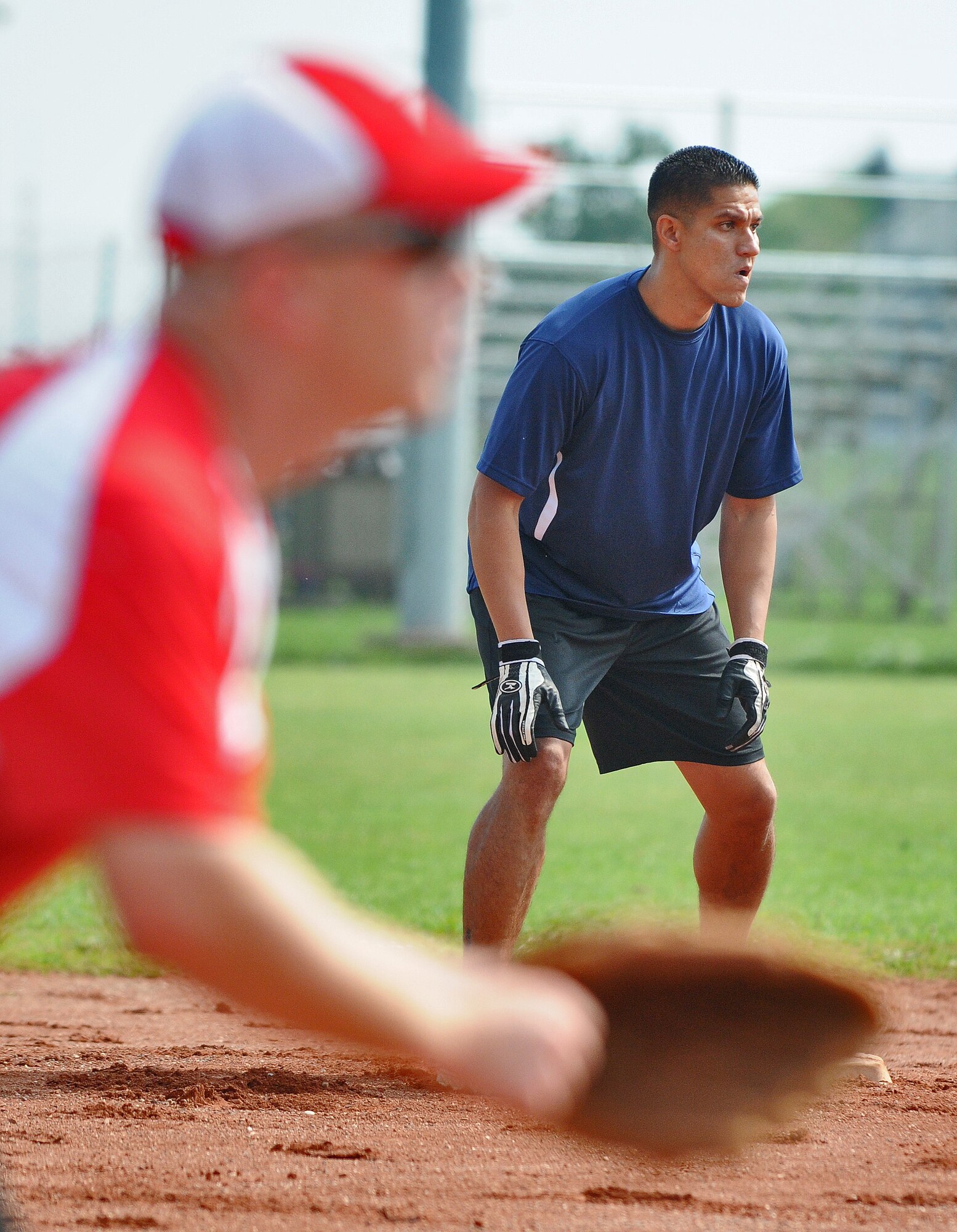 SPANGDAHLEM AIR BASE, Germany -- Michael Esarey, Royal Air Force Croughton Cougars, sprints to third base during a U.S. Air Forces in Europe Small Units Softball Tournament game against the 606th Air Control Squadron Galley Warriors here Aug. 4. The 726th Air Mobility Squadron won the tournament or out the seven teams from across Europe that competed. (U.S. Air Force photo/Senior Airman Nick Wilson)