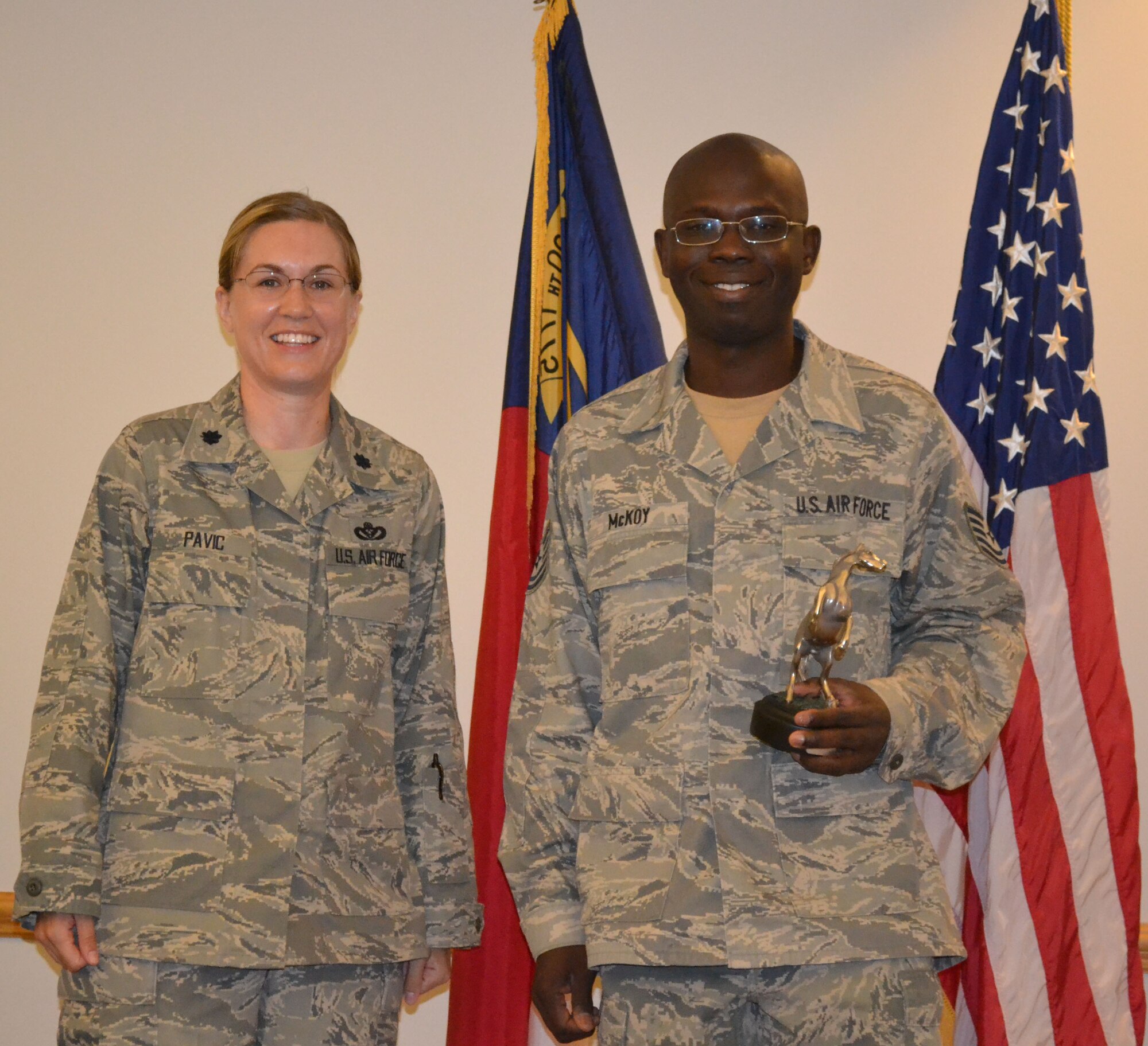 Tech. Sgt. Marlon McCoy (right) was named the 567th RED HORSE Squadron's NCO of the Quarter. In addition, Senior Airman Dante Humphrey and Senior Master Sgt. Gary Smith also earned quarterly awards. (USAF photo by SRA Kristopher Barrow, 567RHS)