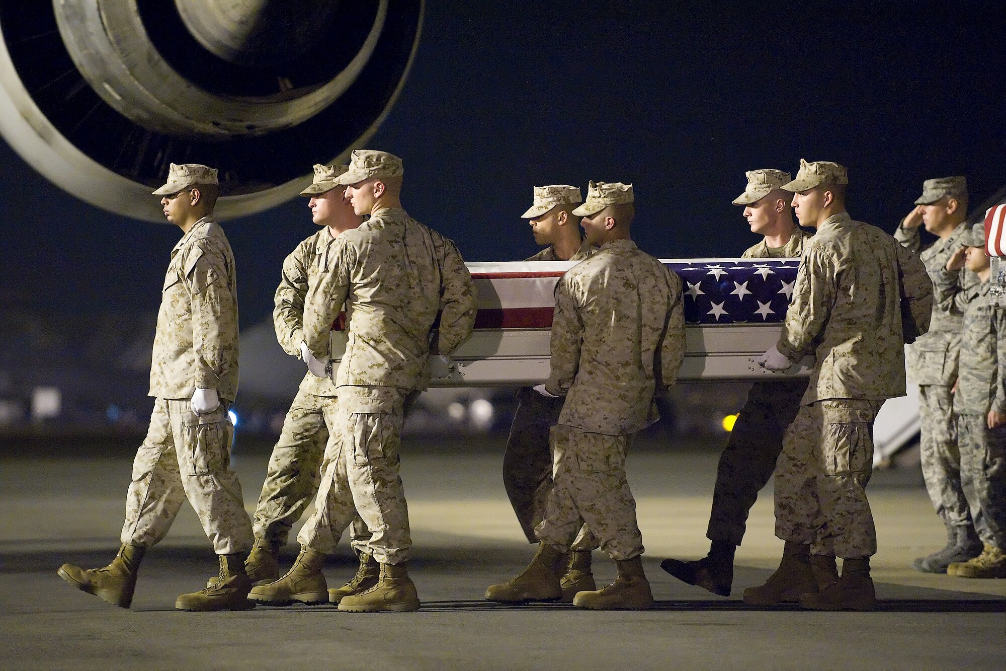 A U.S. Marine Corps carry team transfers the remains of Marine Sgt. Daniel D. Gurr, of Vernal, Utah, at Dover Air Force Base, Del., Aug. 8, 2011. Gurr was assigned to the 3rd Reconnaissance Battalion, 3rd Marine Division, II Marine Expeditionary Force (Forward), Okinawa, Japan. (U.S. Air Force photo/Steve Kotecki)