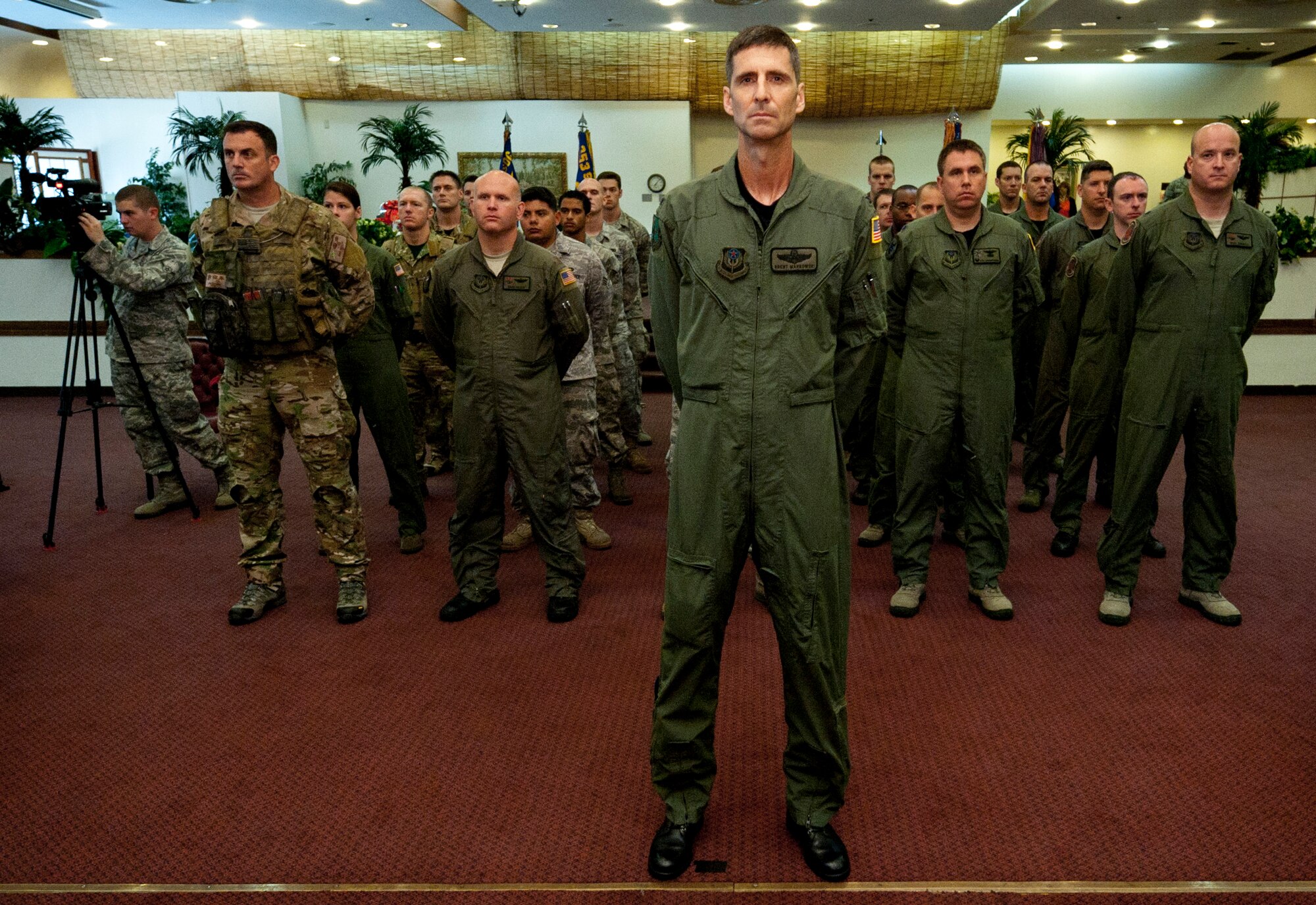 YOKOTA AIR BASE, Japan -- Col. Brent Markowski, the 353rd Special Operations Group deputy commander, leads a formation of Airmen from the group during a change of command ceremony here Aug. 5. The ceremony was held at the Officers' Club here two days after Airmen and aircraft evacuated Kadena Air Base for Typhoon Mufia. (U.S. Air Force photo by Staff Sgt. Sam Morse)