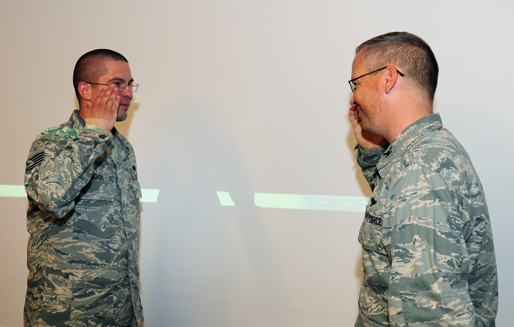 Tech. Sgt. Aaron Gagnon, 39th Logistics Readiness Squadron NCO in charge of fixed facilities, salutes Col. Anthony Butts, 39th Air Base Wing commander, after being informed he will join the air staff at the Pentagon as one of only two people in his career field selected for the Logistic Education Advancement Program Aug. 2, 2011, at Incirlik Air Base, Turkey. LEAP is a career-broadening education program designed to provide selected NCOs with on-the-job experience and training in special fuels logistics areas. (U.S. Air Force photo by Senior Airman Anthony Sanchelli/Released)