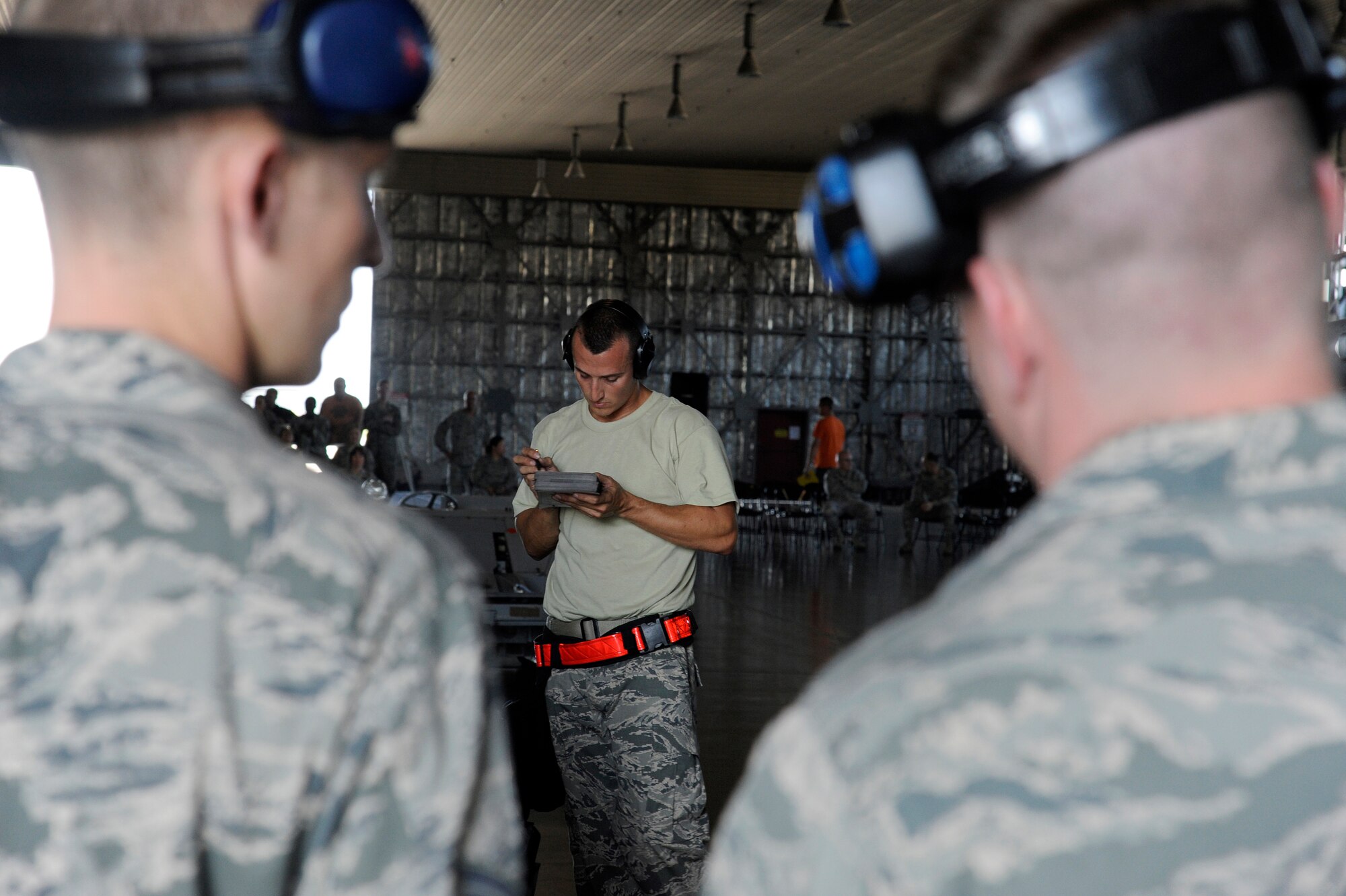 MISAWA AIR BASE, Japan -- Staff Sgt. Joshua Hollenbaugh, 13th Aircraft Maintenance Unit, reviews a checklist prior to completion during the load crew-of-the-quarter competition Aug. 5. Each load requires the crew chief to use a checklist specific to the munition being loaded. (U.S. Air Force photo/Staff Sgt. Marie Brown)