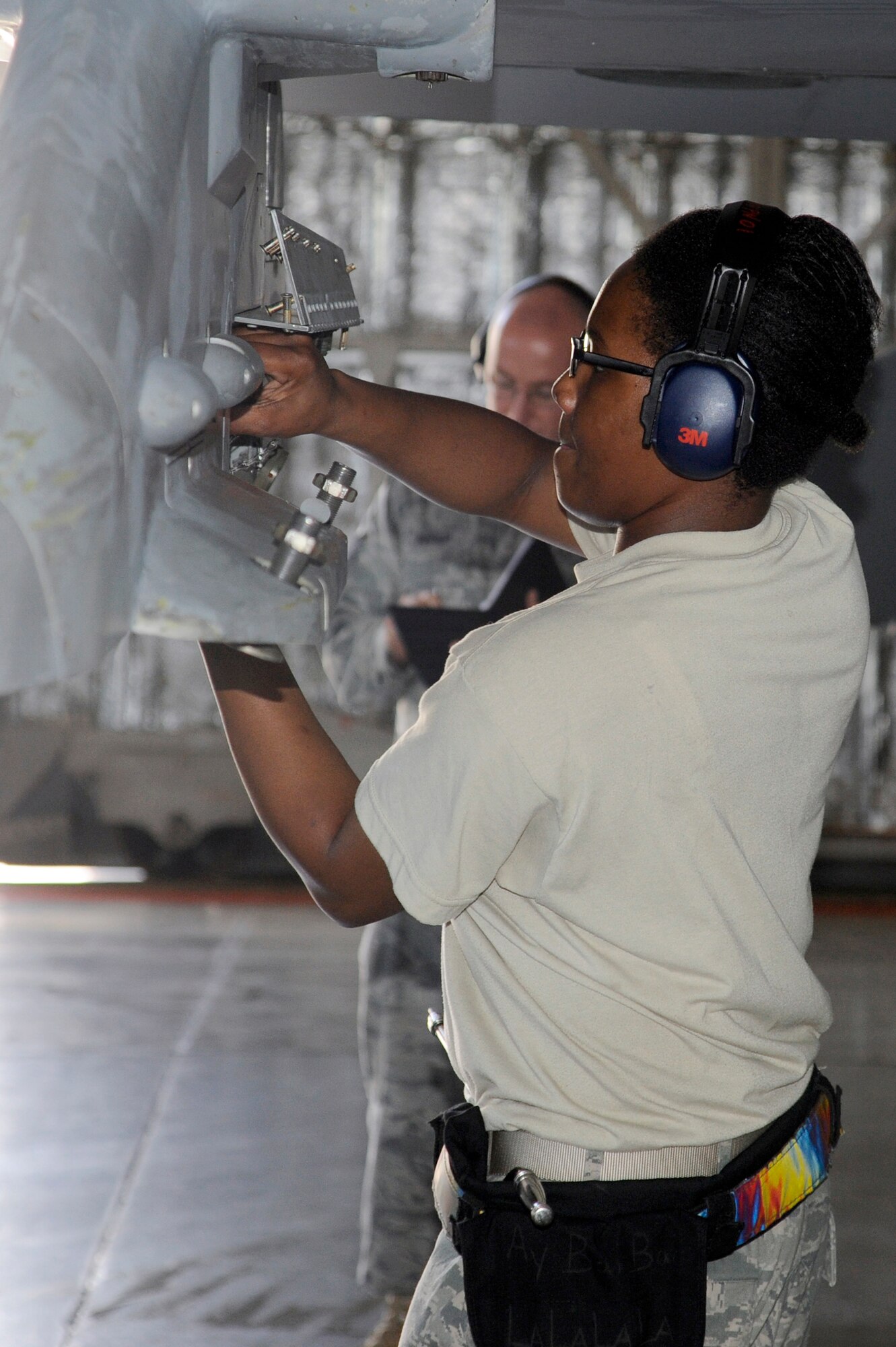 MISAWA AIR BASE, Japan --  Senior Airman Alexcia Bailey, 14th Aircraft Maintenance Unit, installs a Joint Direct Attack Munition GBU-31 cable prior to the inert munition being uploaded during the load crew-of-the-quarter competition Aug. 5. The competition is held to see who the best weapons load crew is for the quarter. At the end of the year, each of the quarterly winners compete for the title of "load crew of the year." (U.S. Air Force photo/Staff Sgt. Marie Brown) 