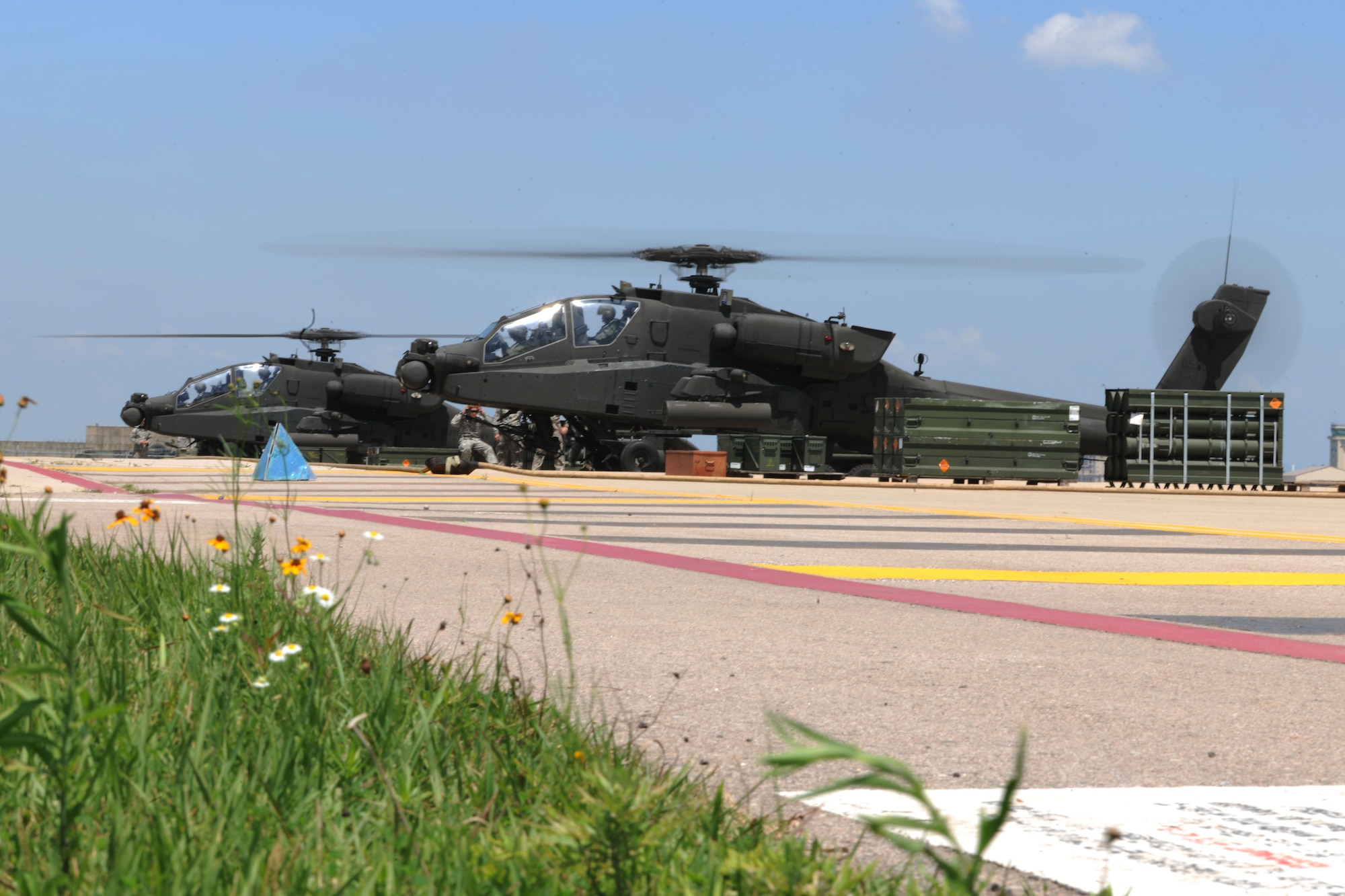 KUNSAN AIR BASE, Republic of Korea -- Two AH-64D Apache Longbows, land after participating in the buddy laser exercise, here Aug. 5. Army and Air Force units teamed up for a joint training exercise at Jikdo Island, firing AGM-114 Hellfire missiles, rockets and 30mm munitions at the range.  (U.S. Air Force photo/Senior Airman Brittany Y. Bateman)