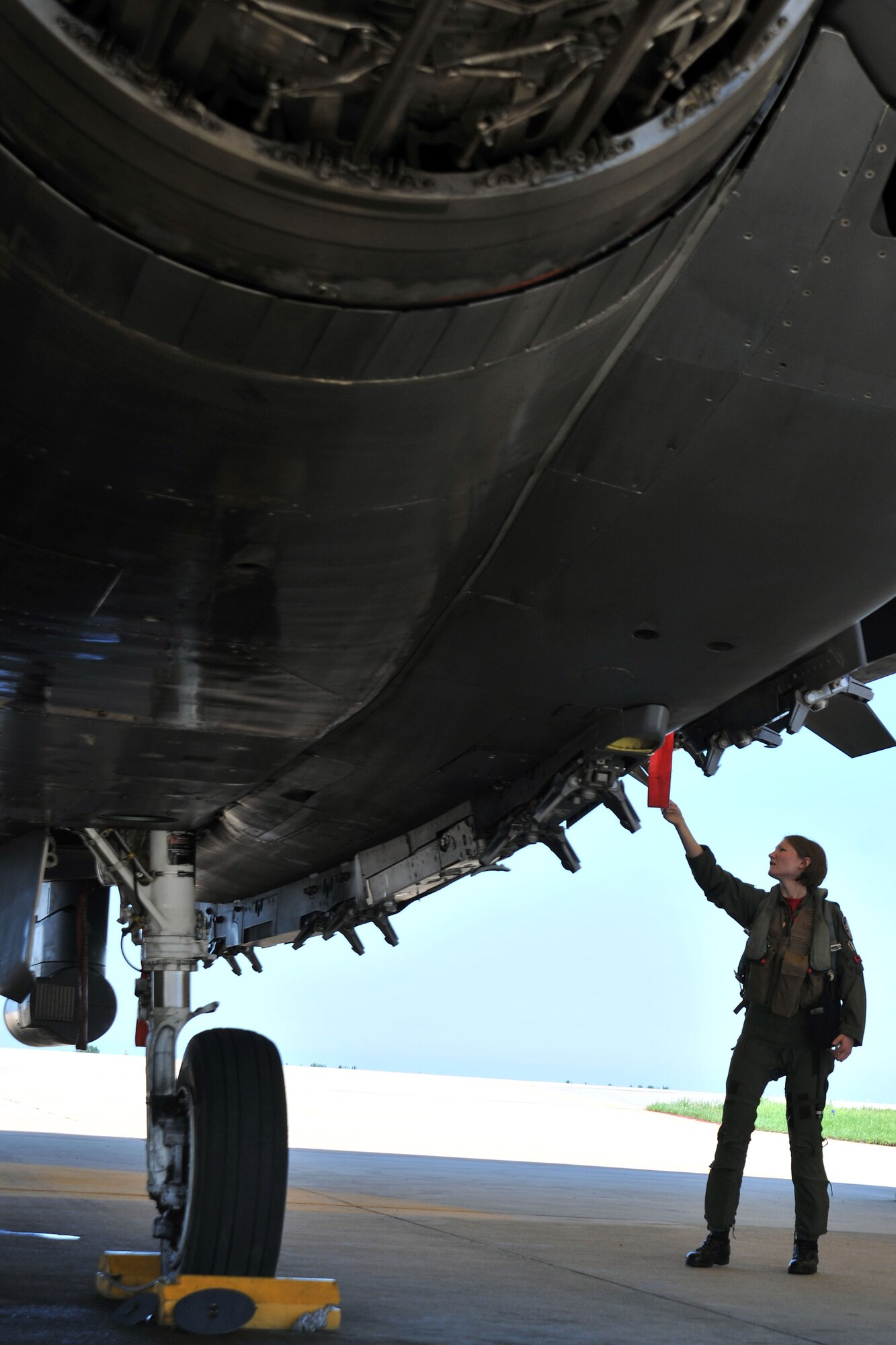 KUNSAN AIR BASE, Republic of Korea -- Capt Sarah Odell, 494th Expeditionary Fighter Squadron F-15E Eagle Strike pilot, performs a pre-flight inspection on a F-15E here Aug. 5. RAF Lakenheath’s 494th Expeditionary Fighter Squadron is currently deployed to Kunsan as part of the theater support package and has been on station for approximately three months. (U.S. Air Force photo/Senior Airman Brittany Y. Bateman)