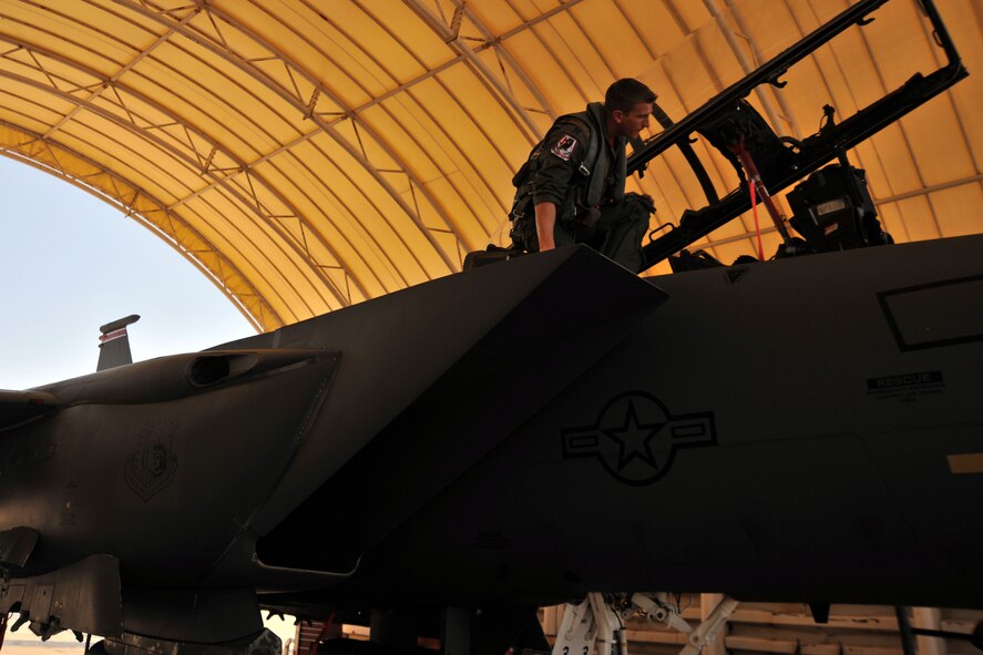 KUNSAN AIR BASE, Republic of Korea -- Capt. Titus Amundson, 494th Expeditionary Fighter Squadron weapon systems officer from Royal Air Force Lakenheath, England, performs a pre-flight inspection on a F-15E Eagle Strike here Aug. 5. Army and Air Force units teamed up for a joint training exercise at Jikdo Island, firing AGM-114 Hellfire missiles, rockets and 30mm munitions at the range. (U.S. Air Force photo/Senior Airman Brittany Y. Bateman)