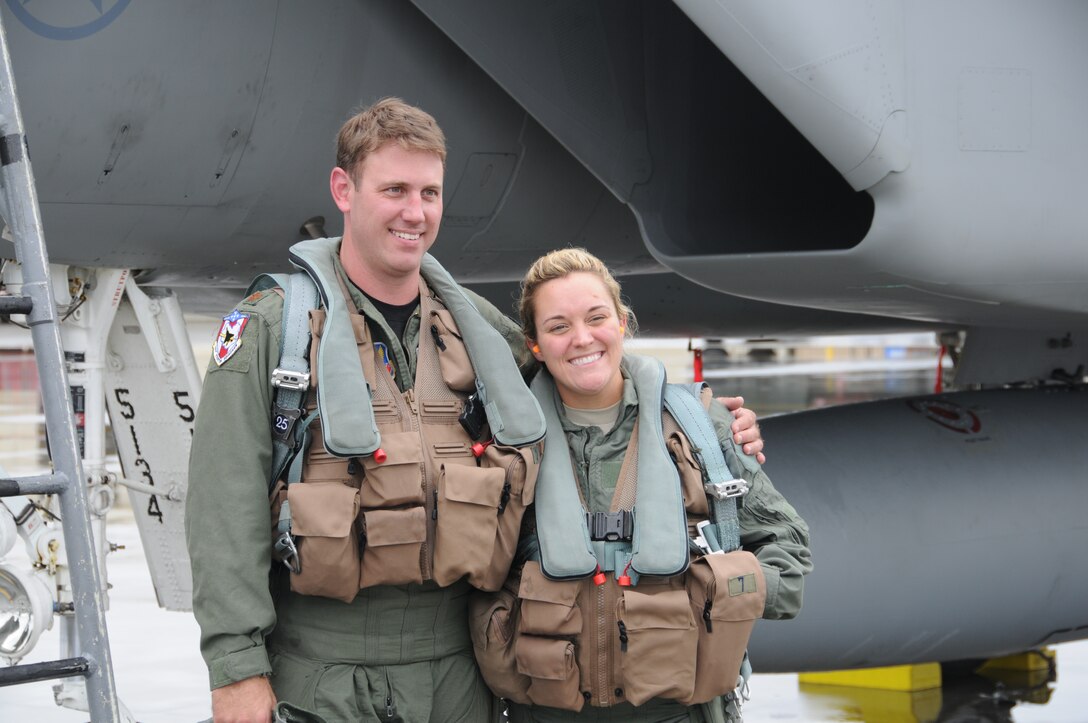 Technical Sergeant Tina Blake and Major Jeff "Monty" Beckel pose after an incentive flight in an F-15D while deployed to Joint Base Elmendorf-Richardson, Alaska.  Incentive flights give deserving airmen an opportunity to experience the thrill of flight in an F-15 Eagle.  (U.S. Air Force Photo by: Technical Sergeant, Anthony Mutti)