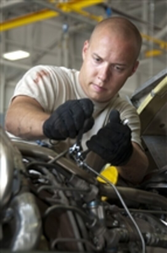 U.S. Air Force Tech. Sgt. Andrew Arnett, with a maintenance squadron with the 117th Air Refueling Wing, prepares to swap the #4 engine on a KC-135R Stratotanker aircraft in Birmingham, Ala., on July 26, 2011.  