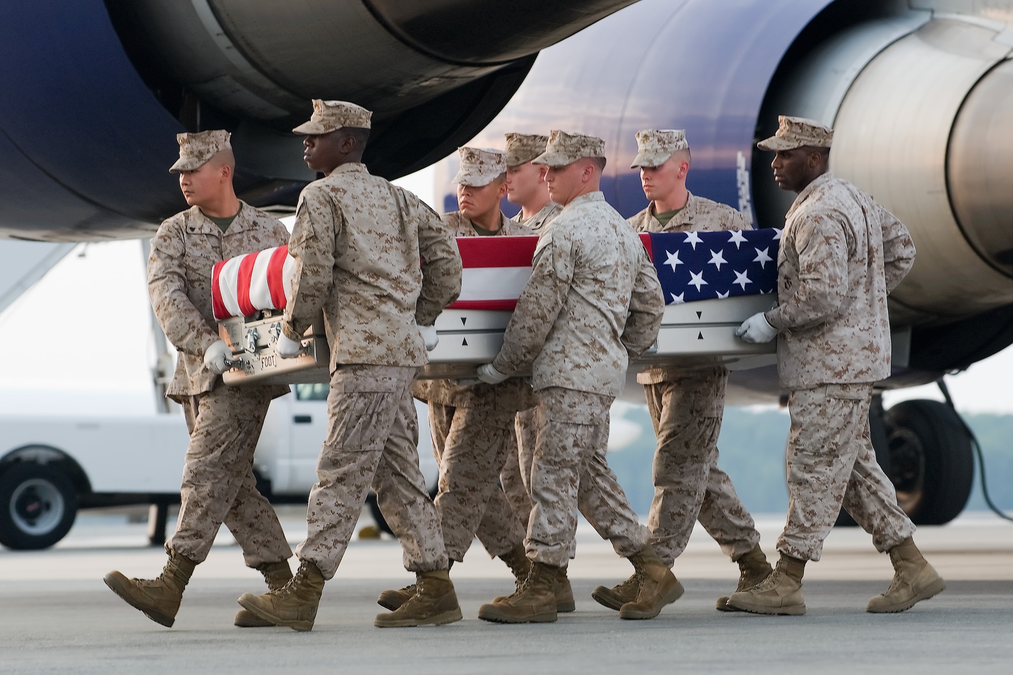 A U.S. Marine Corps carry team transfers the remains of Marine Sgt. Joshua J. Robinson, of Omaha, Neb., at Dover Air Force Base, Del., Aug. 9, 2011. Robinson was assigned to the 1st Battalion, 5th Marine Regiment, 1st Marine Division, I Marine Expeditionary Force, Camp Pendleton, Calif. (U.S. Air Force photo/Steve Kotecki)