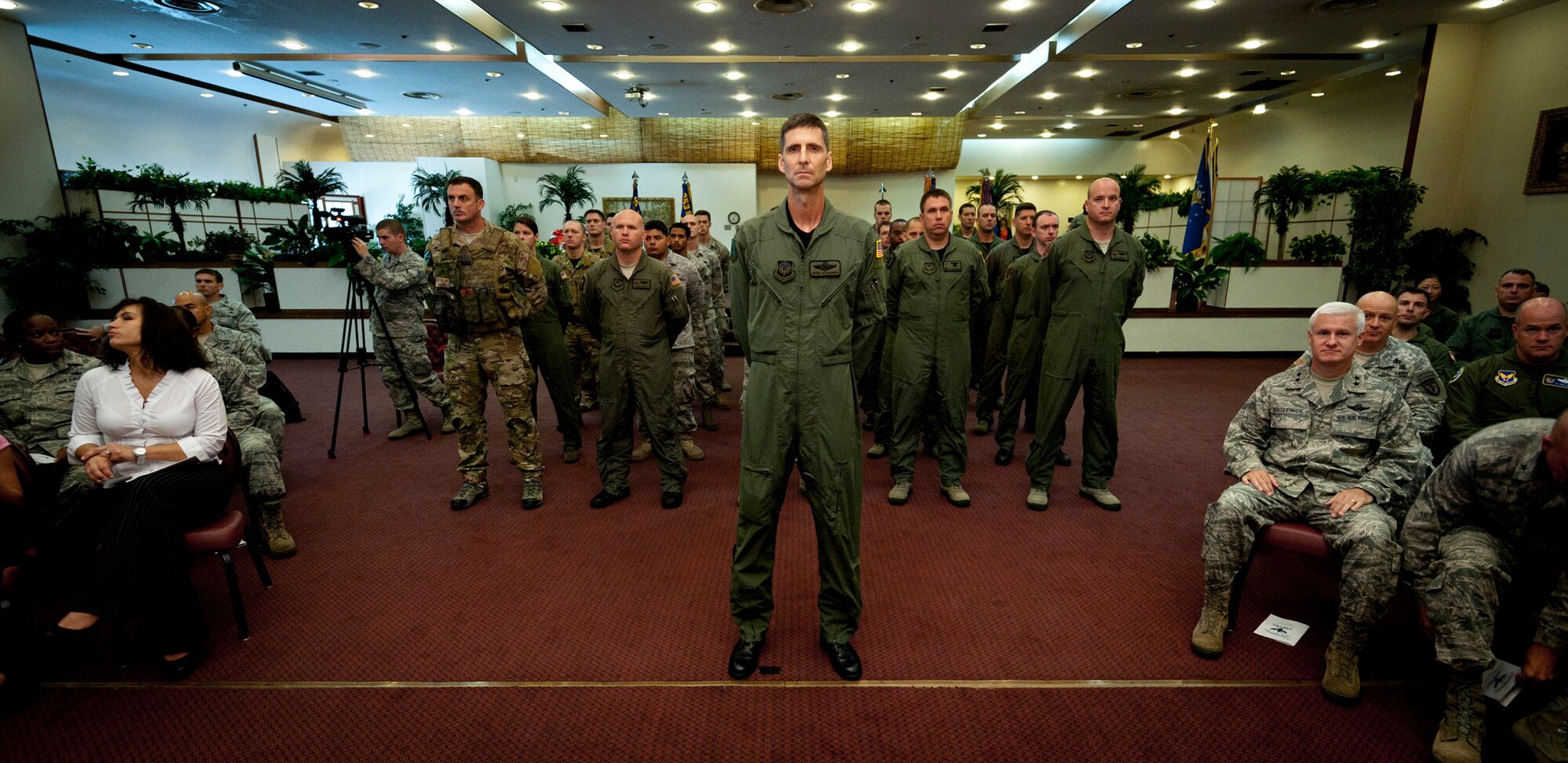 YOKOTA AIR BASE, Japan -- A formation of Airmen from the 353rd Special Operations Group stand at parade rest during the group's change of command ceremony at Yokota Air Base, Japan, Aug. 5, 2011. The Airmen and their aircraft were evacuated to Yokota Air Base to avoid a typhoon headed toward their home station of Kadena Air Base, and held their change of command ceremony despite their relocation. (U.S. Air Force photo/Staff Sgt. Samuel Morse)