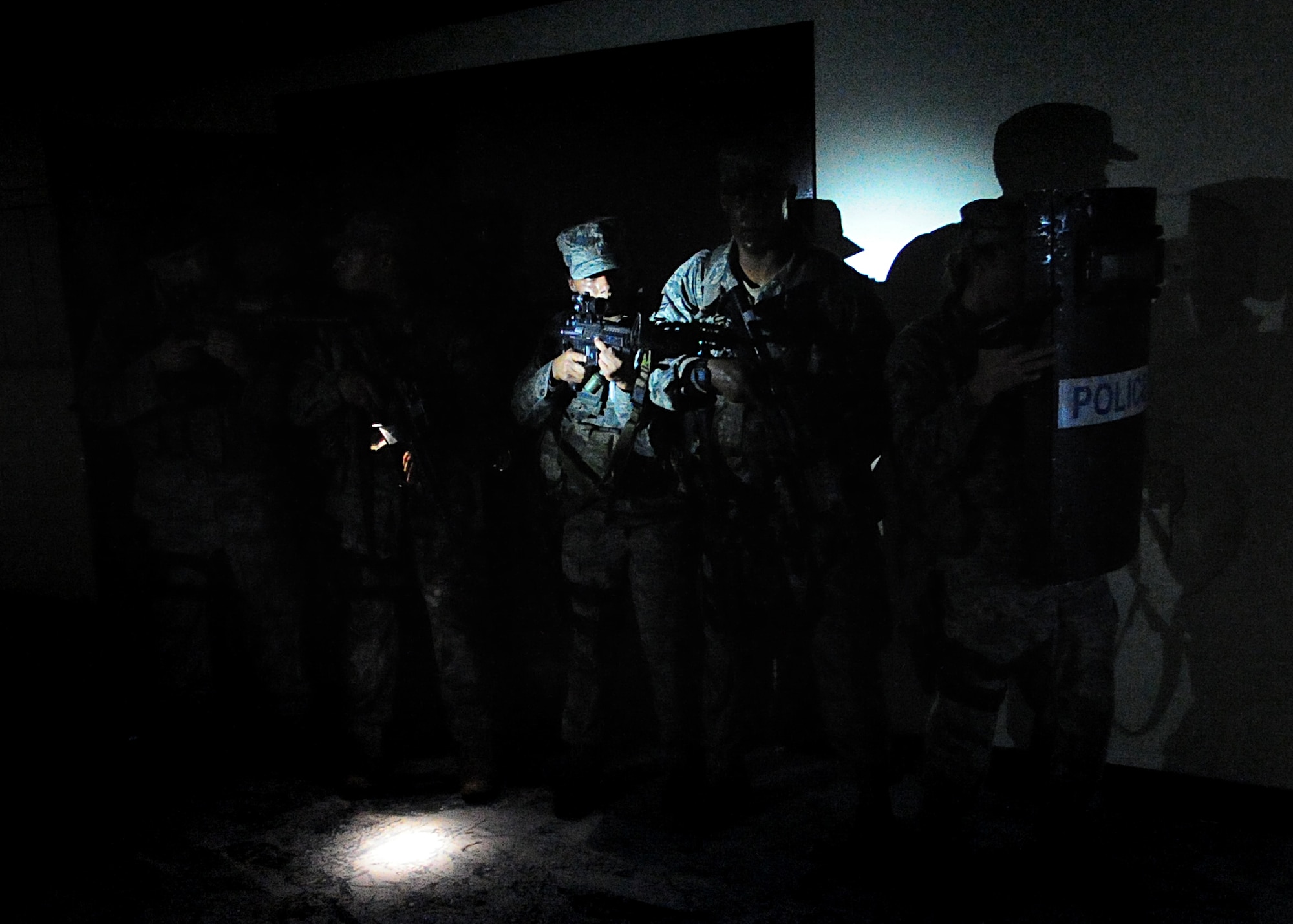 Airmen of the 51st Security Forces endure day zero during the Quick Response Team try-outs here, July 8.  During the intense training, SF members' were challenged both physically and mentally to complete required elements to continue training.  Day zero, also known as ‘smoke day’, 27 Airmen were asked to meet and befriend fatigue performing, 70 pound buddy low and high drags/carries, a 5k with 100 pound log carried as a squad, clearing buildings and tactical troop movements.  Physical training sessions were themed in memory of the 31 warriors lost in Afghanistan, July 7, by each volunteer completing 31 of each exercise throughout the course.   A QRT member provides immediate response to any high risk situation on Osan Air Base to include barricaded suspects, workplace violence, domestic violence and abuse response, school violence, and disaster response.  (U.S. Air Force Photo By/Staff Sgt. Daylena Gonzalez)
*Note: 1 of 4 mini-series
