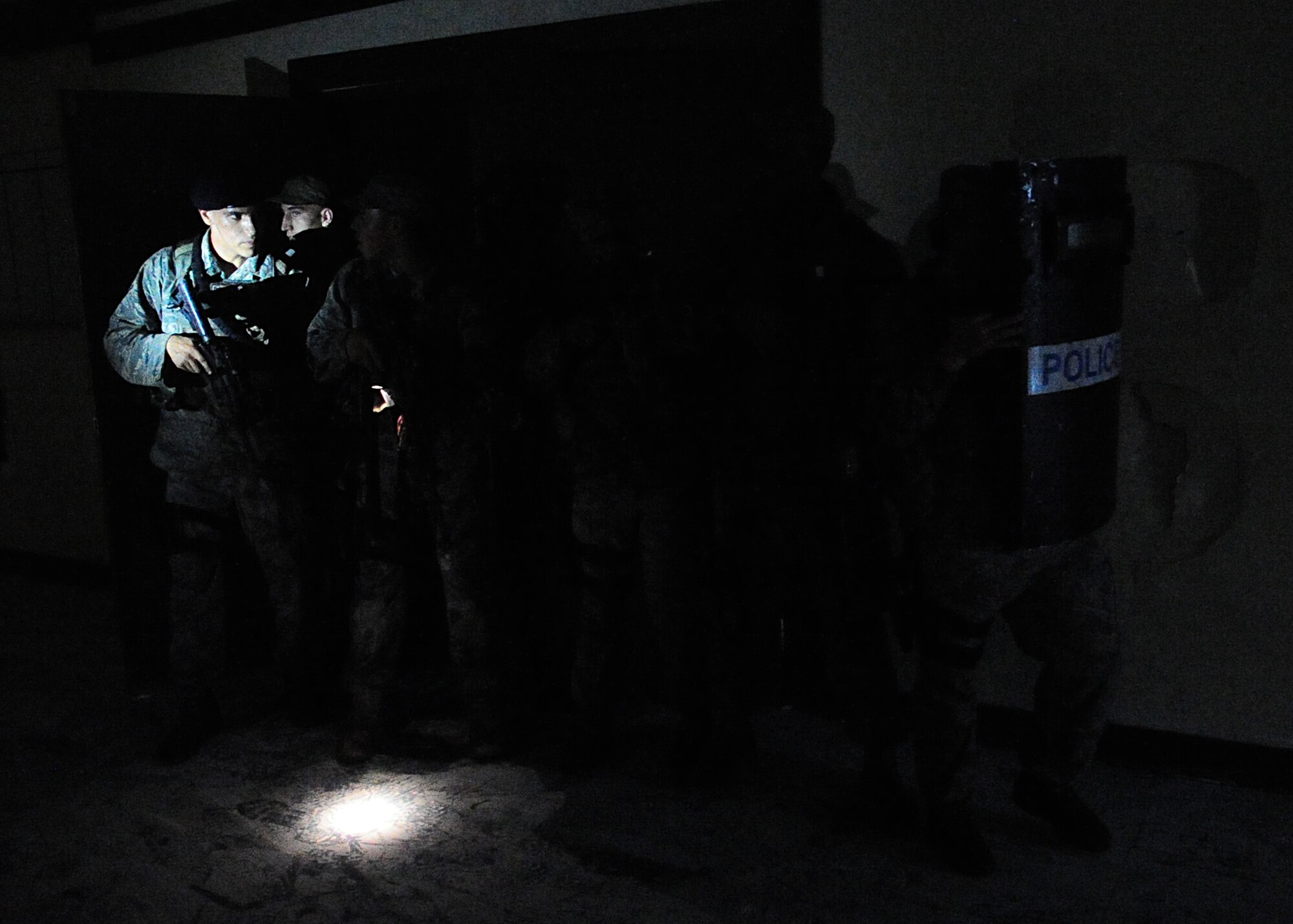 Airmen of the 51st Security Forces endure day zero during the Quick Response Team try-outs here, July 8.  During the intense training, SF members' were challenged both physically and mentally to complete required elements to continue training.  Day zero, also known as ‘smoke day’, 27 Airmen were asked to meet and befriend fatigue performing, 70 pound buddy low and high drags/carries, a 5k with 100 pound log carried as a squad, clearing buildings and tactical troop movements.  Physical training sessions were themed in memory of the 31 warriors lost in Afghanistan, July 7, by each volunteer completing 31 of each exercise throughout the course.   A QRT member provides immediate response to any high risk situation on Osan Air Base to include barricaded suspects, workplace violence, domestic violence and abuse response, school violence, and disaster response.  (U.S. Air Force Photo By/Staff Sgt. Daylena Gonzalez)
*Note: 1 of 4 mini-series
