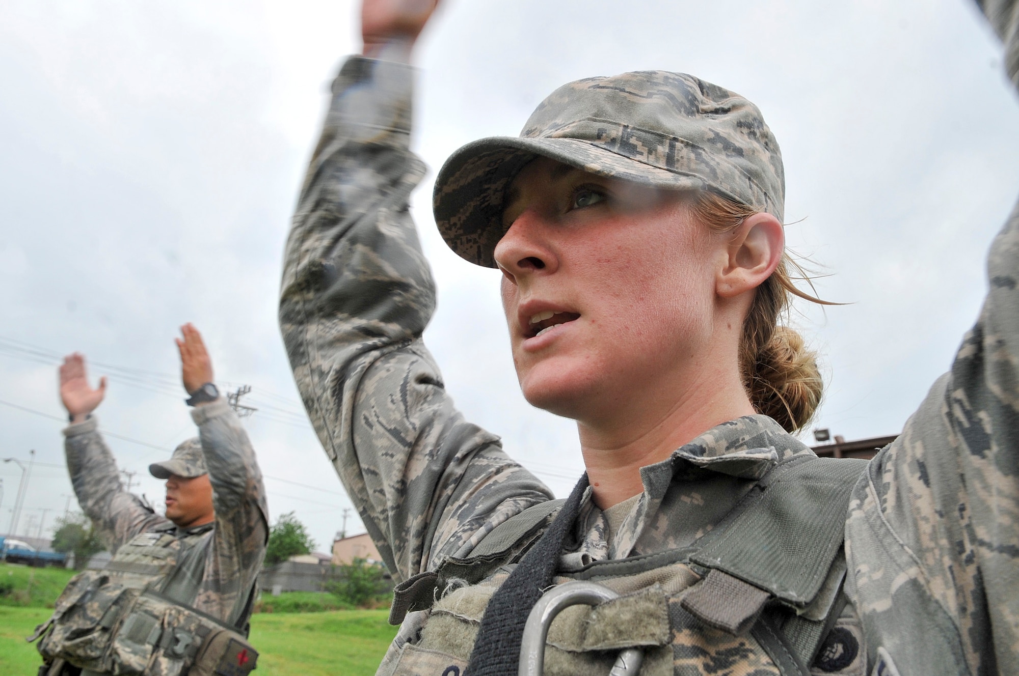 The 51st Security Forces Squadron, held try-outs for the Quick Response Team here, July 8. The purpose of the QRT is to provide an immediate response to any high risk situation on Osan Air Base to include barricaded suspects, workplace violence, domestic violence and abuse response, school violence, and disaster response. During the tryouts Airmen were tested both physically and mentally with the ultimate goal of only selecting the best of the best. The physical aspect of the try-outs consisted of dragging/carrying a 70 pound buddy for 60 yard, calisthenics, building clearing, weapon assembly, 100 pound over head log presses and a 5K as a squad while securing the 100 pound log. During the rigorous try-outs Airmen are pushed to their limits and often loose hand eye coordination, basic motor skills and attention to detail. These factors simulate the effects real world operations were members of the QRT are often under extreme duress. (U.S. Air Force Photos by/ Senior Airman Adam Grant)