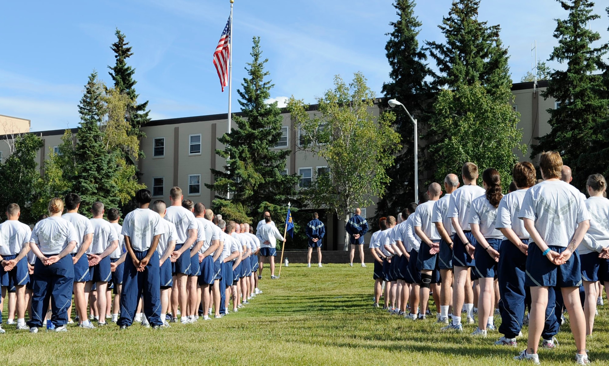 Airmen from the 354th Fighter Wing hold a retreat ceremony in front of Amber Hall Aug. 8, 2011, Eielson Air Force Base, Alaska. After the ceremony, the wing held a 5K run. Units ran in formation for more than half of the course. (U.S. Air Force photo/Staff Sgt. Miguel Lara III)