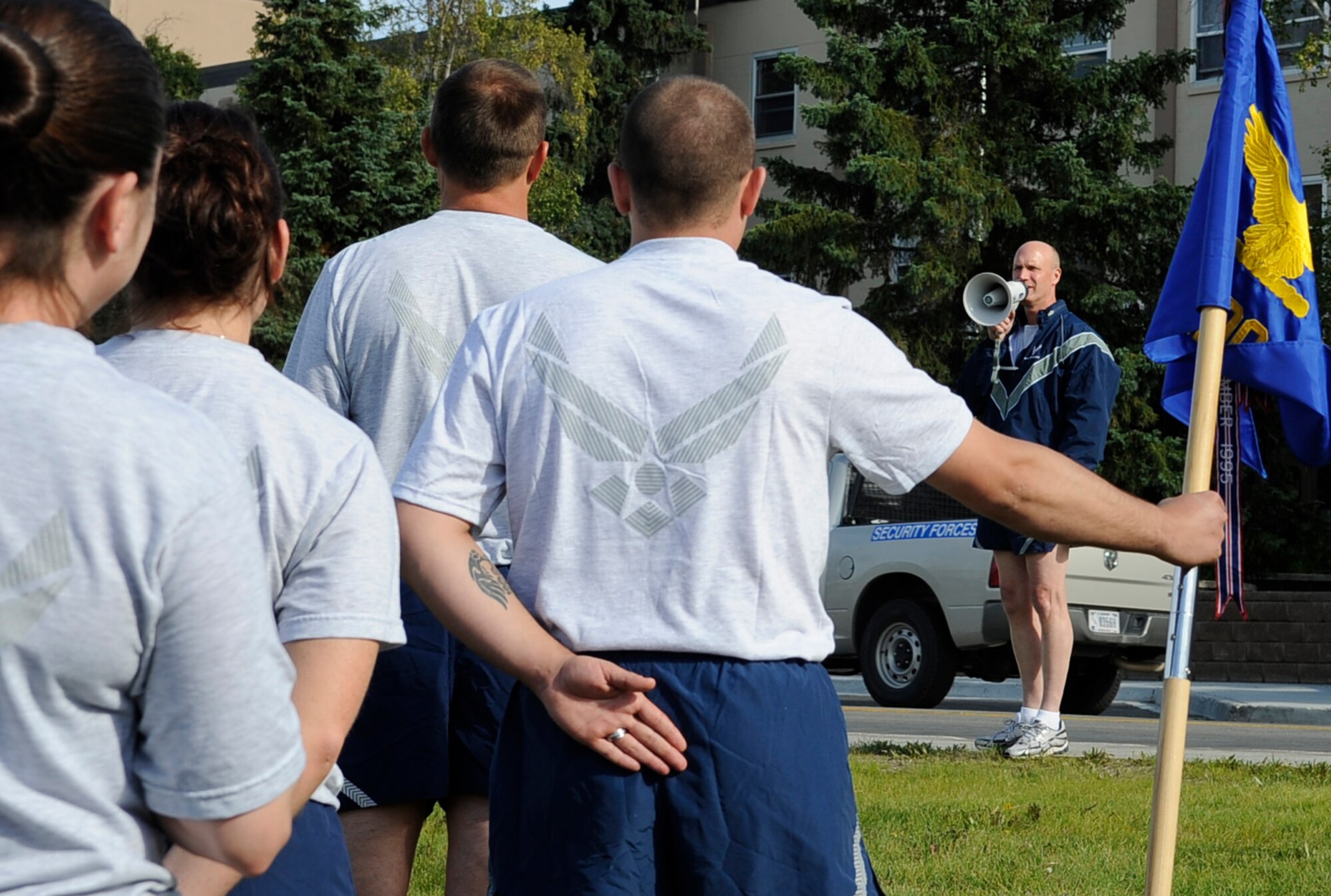 Brig. Gen. James Post III, 354th Fighter Wing commander, speaks to Airmen after a retreat ceremony in front of Amber Hall Aug. 8, 2011, Eielson Air Force Base, Alaska. After the ceremony, the wing held a 5K run. Units ran in formation for more than half of the course. (U.S. Air Force photo/Staff Sgt. Miguel Lara III)