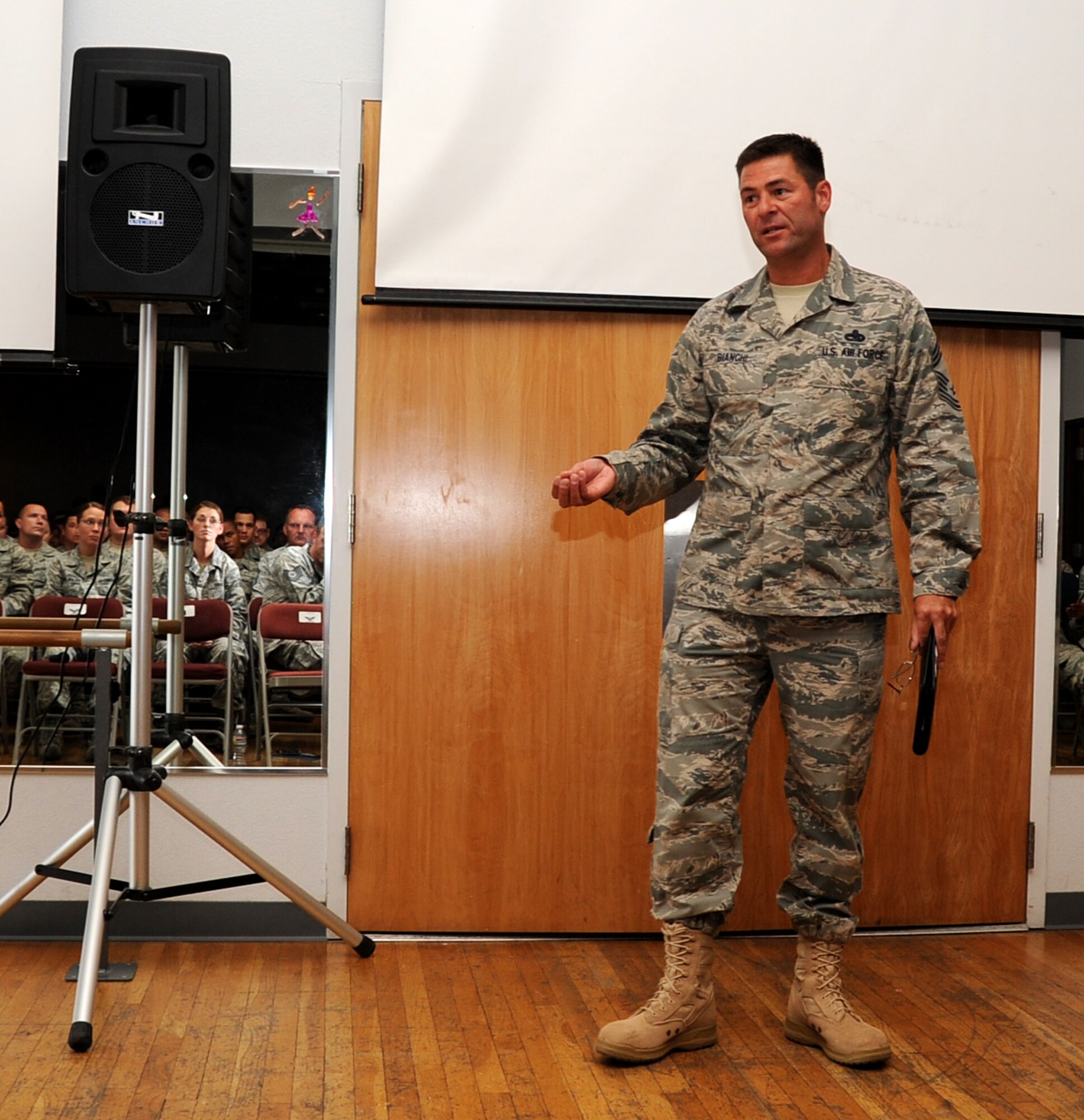 The interim command chief for the 920th Rescue Wing, Chief Master Sgt. Timothy Bianchi addresses 943rd Rescue Group Airmen during an all enlsited call during the August Unit Training Assembly weekend. He addressed many of the issues facing the Air Force Reserve. (U.S. Air Force Photo/ Tech. Sgt. Luke Johnson)