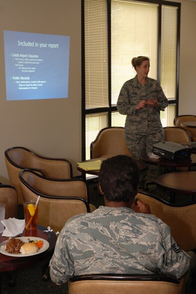 Master Sgt. Renee Cooper, 94th Airlift Wing Human Resource Development Council, teaches a lunch-time class on reading credit scores at the Consolidated Club on August 6. The class was held as part of the HRDC’s Airmen Enriching Airmen program, which allows Airmen with expertise in a given subject to host a class to help educate others. (U.S. Air Force photo/Senior Airman Spencer Gallien)