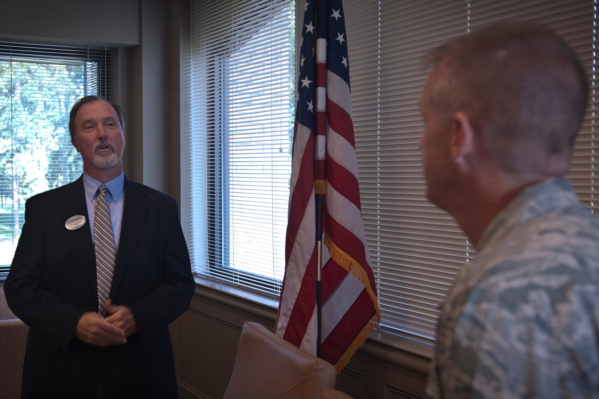Dr. Ray Perren, Wiregrass Technical College president, speaks to U.S. Air Force Col. Mark Koppen, 23rd Medical Group commander, about the great opportunity for college students to work alongside military members at WTC, Valdosta, Ga., Aug. 9, 2011. Koppen signed a training affiliation agreement that allows WTC students to complete part of their curriculum working alongside Airmen from the 23rd MDG on Moody Air Force Base, Ga. (U.S. Air Force by Airman 1st Class Joshua Green/Released)
