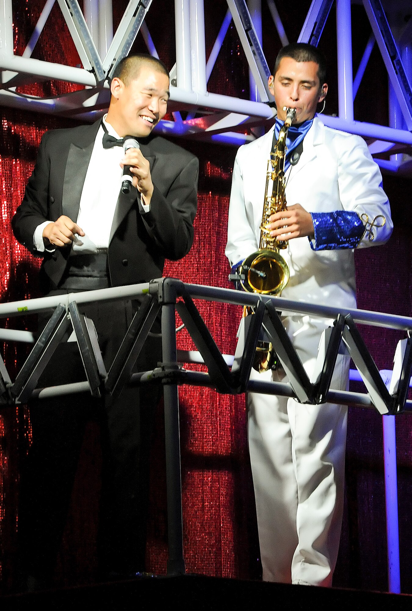 Staff Sgt. Mark Lindquist (left), a vocalist with Tops in Blue, and Airman 1st Class Gabriel Villaneuva, tenor saxophonist, perform a musical piece Aug. 7, 2011, at Delaware State University at Dover, Del. (U.S. Air Force photo by Airman 1st Class Samuel Taylor)