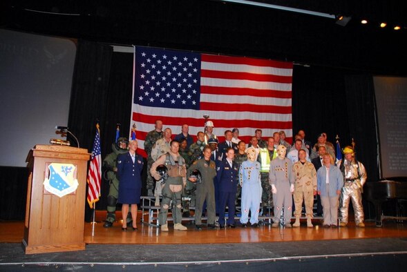 Members of the 148th Fighter Wing, in a variety of
career fields and uniforms, get ready for the OSHA Voluntary Protection
Program "Star" rating presentation during an awards ceremony in June 2008.
