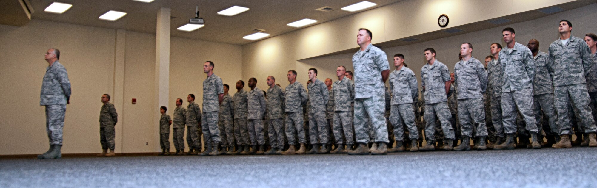 Members of the 403rd Maintenance Group stand at parade rest as their new commander, Col. Anna Schulte, addresses them for the first time. Schulte took command Aug. 6.  (U.S. Air Force Photo by Maj. Heather Newcomb)