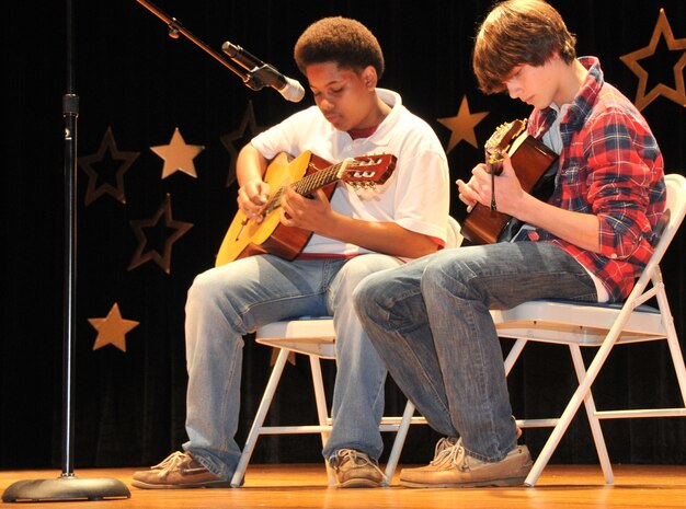 Jourdain Mast (left) and Logan Broughton strum their guitars during the 2011 ?You Got Talent,? Family and Teen Talent contest, Feb. 5, 2011, at Joint Base Charleston-Air Base theater. Jourdain is the son of retired Master Sgt. Kendrick Mast and Logan is the son of Master Sgt. Jeremy Davis from the 315th Aircraft Maintenance Squadron. (U.S. Air Force photo/Airman 1st Class Jared Trimarchi)
