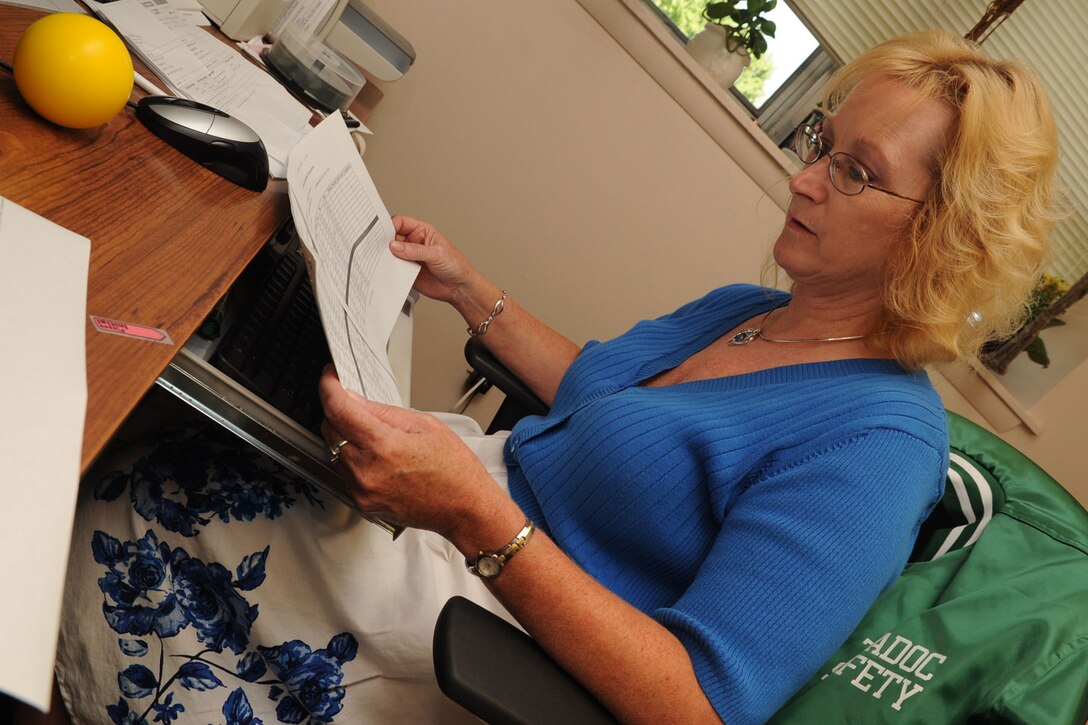 Dawn Joyner, 633rd Air Base Wing Safety Office safety technician, reviews the Beginners Motorcycle Safety Foundation course schedule for upcoming classes at Fort Eustis Aug. 2, 2011. The safety office places emphasis on safe driving practices while educating newly assigned personnel of the local driving hazards. (U.S. Air Force photo by Airman 1st Class Racheal Watson/Released)