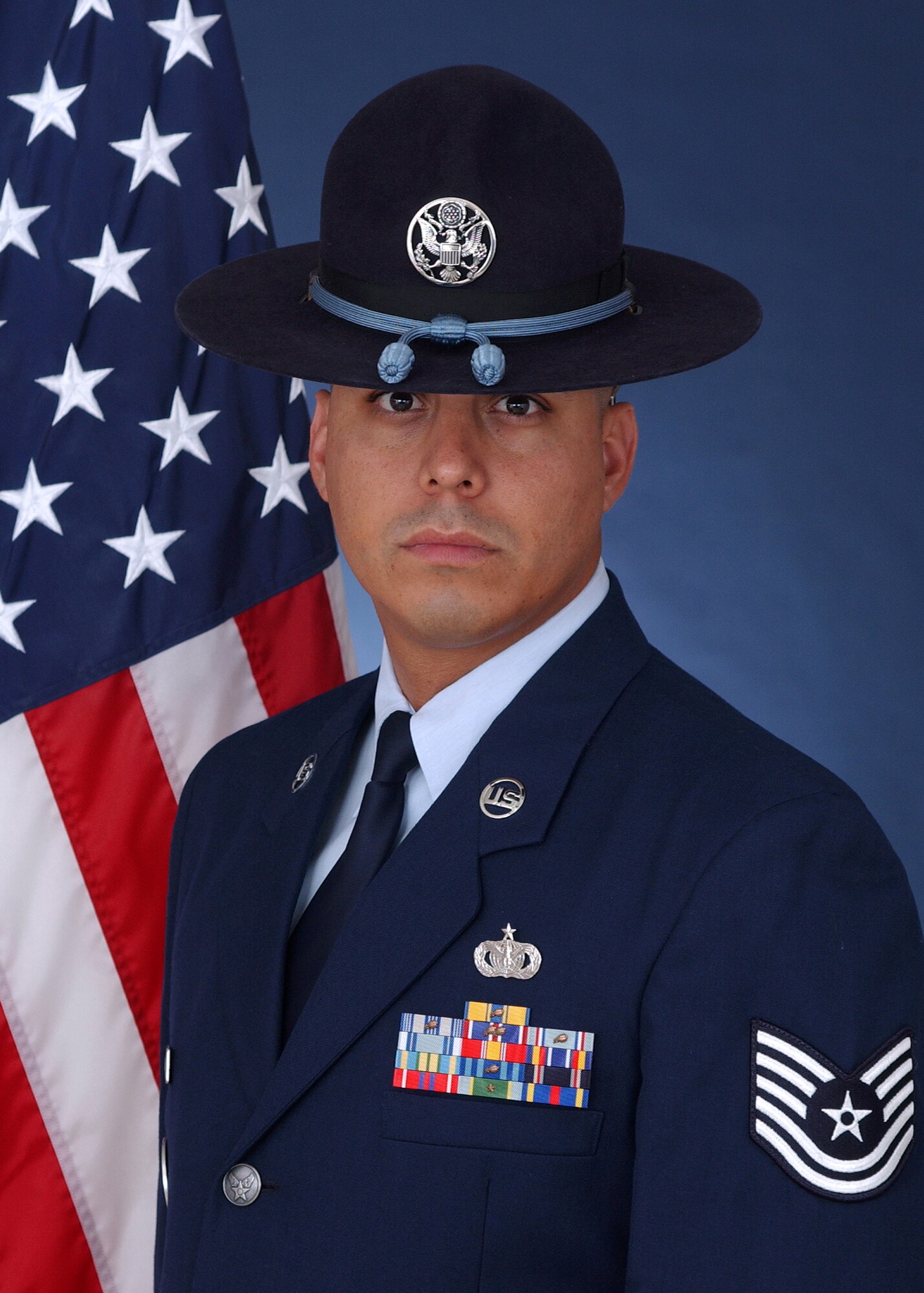 Tech. Sgt. Ricardo Chavez, 433rd Training Squadron military training instructor, official Air Force photo with traditional MTI hat with blue rope, which symbolizes his status as a master military training instrustor. Chavez currently serves fulltime on an Active Guard and Reserve tour of duty as the 737th Training Support Squadron unit training manager. Besides his MTI duties, Chavez is responsible for the overall management of the unit's training program. He conducts comprehensive trainee orientation and compliance documentation for newly assigned instructors.Photo current as of Aug. 9, 2011. (U.S. Air Force photo)