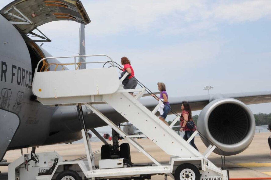 Spouses board a KC-135R Stratotanker as part of the 916th Air Refueling Wing's annual spouse flight orientation on Aug. 7, 2011. More than 20 spouses flew on an air-to-air refueling mission to learn more about the wing's mission in national defense. (USAF photo by TSgt. Scotty Sweatt, 916ARW/PA)