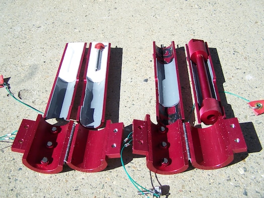 To minimize storage space, Dave Wimer, structural engineer for the Global Hawk Division, designed the tow bar adapter to fit inside one of the main landing gear down locks. (U.S. Air Force photo)