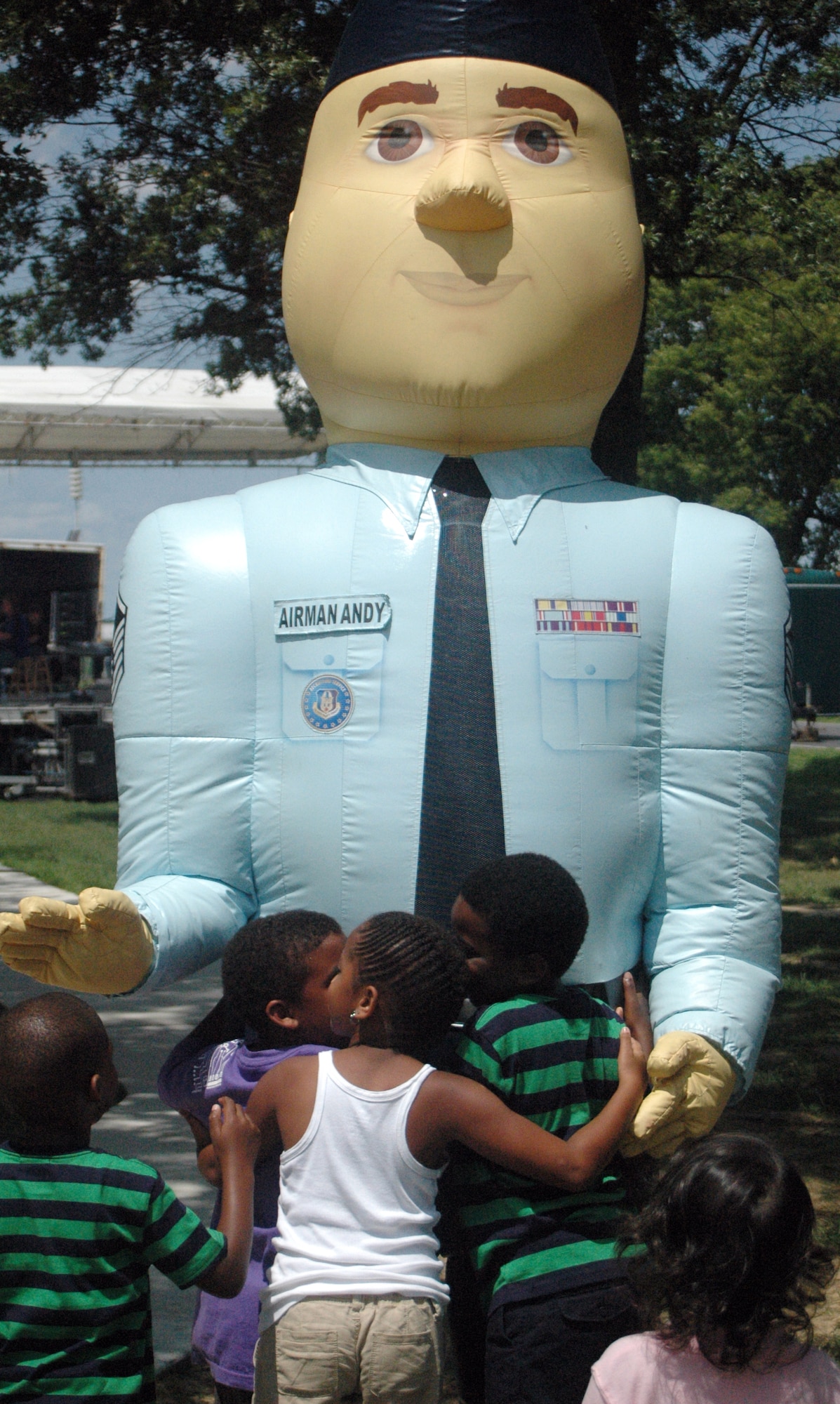 Airman Andy visited with children attending the 512th Airlift Wing biennial picnic Aug. 6 at Eagle?s Nest. More than 2,000 people attended the event that featured live entertainment, a Kids Zone, and hamburgers, hot dogs and ice cream. (U.S. Air Force photo by Senior Airman Tanisha Brown)
