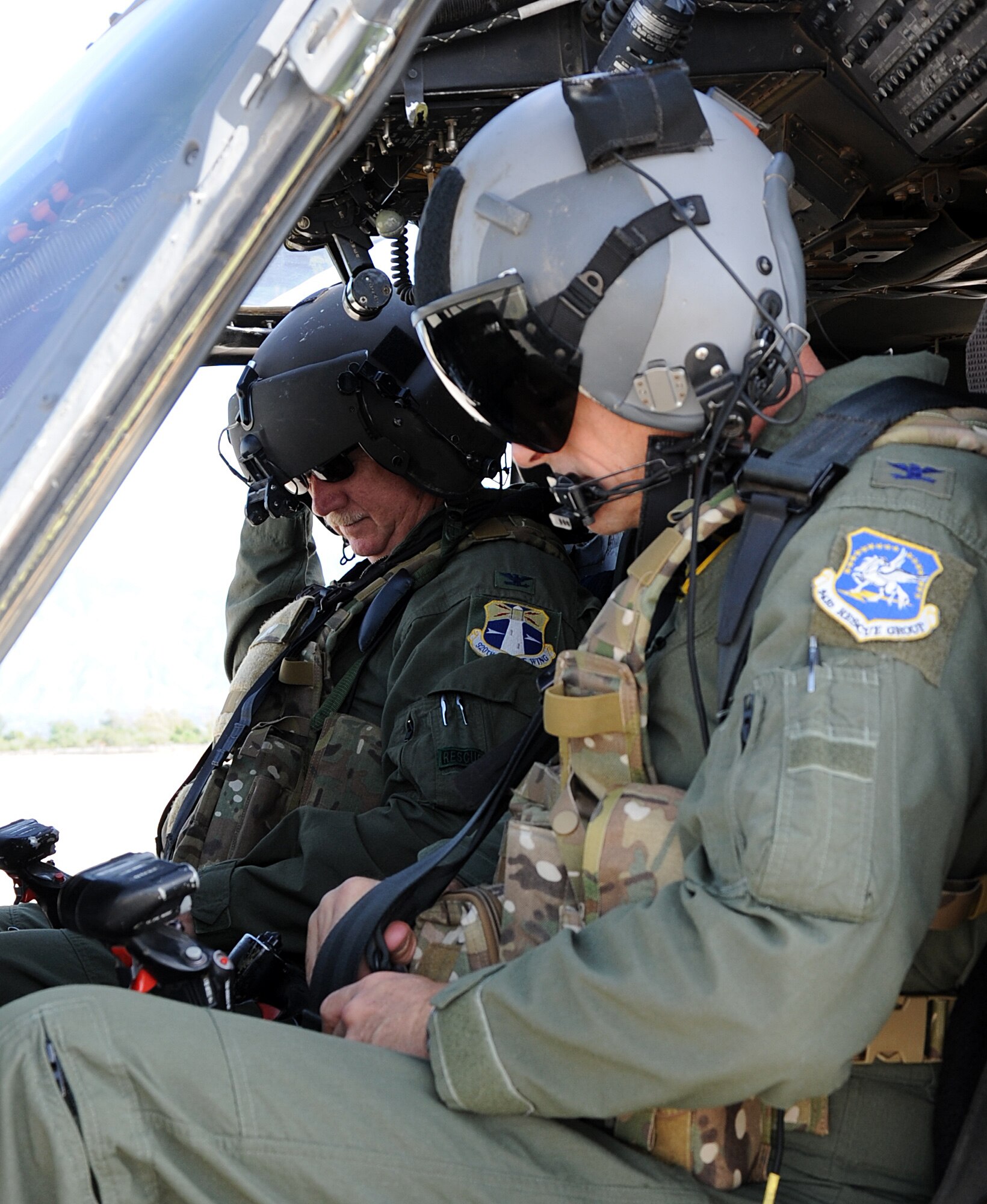 Col. Robert Dunn, 920th Rescue Wing Commander and Col. Harold Maxwell, 943rd Rescue Group Commander, perform preflight checks in the HH-60 Pave Hawk helicopter prior to Colonel Dunn’s final flight with the 943rd RQG. Colonel Dunn visited the 943rd RQG for the final time prior to his retirement in September to thank Airmen with the geographically separated unit for their continued excellence in the combat search and rescue mission. (U.S. Air Force photo/ Tech. Sgt. Luke Johnson) 