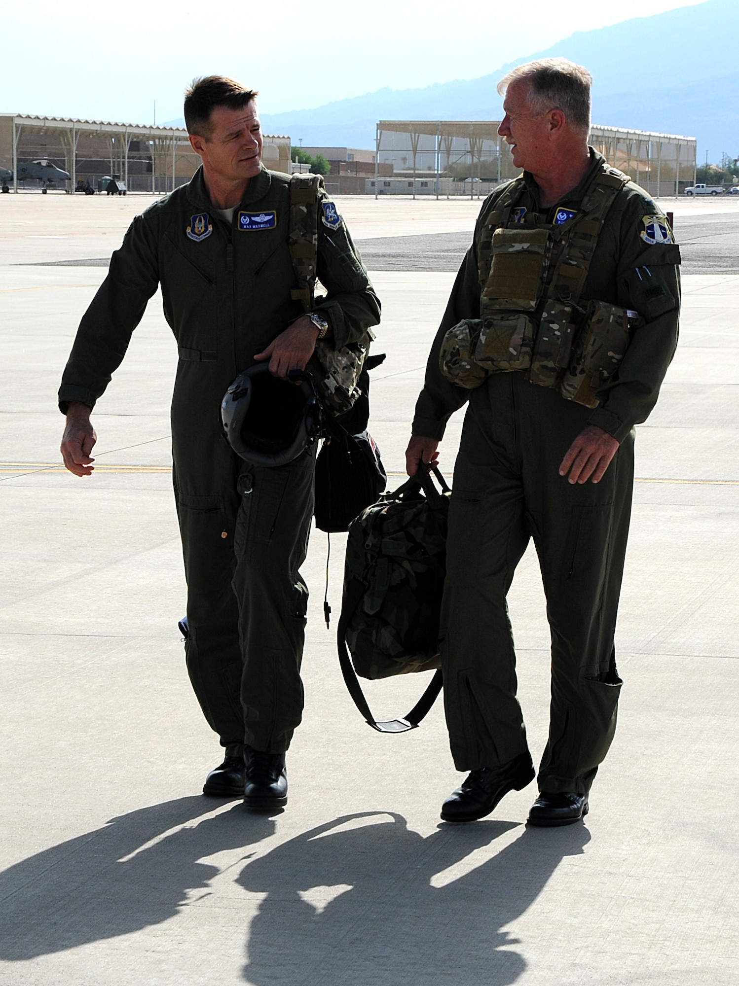 Col. Robert Dunn, 920th Rescue Wing Commander and Col. Harold Maxwell, 943rd Rescue Group Commander, walk out on the flight line at Davis-Monthan Air Force Base, Ariz. prior to Colonel Dunn’s final flight with the 943rd RQG, Aug. 6. Colonel Dunn visited the 943rd RQG for the final time prior to his retirement in September for his final flight and to also address the rescue group for the last time as wing commander during a commander’s call. (U.S. Air Force Photo/ Tech. Sgt. Luke Johnson)