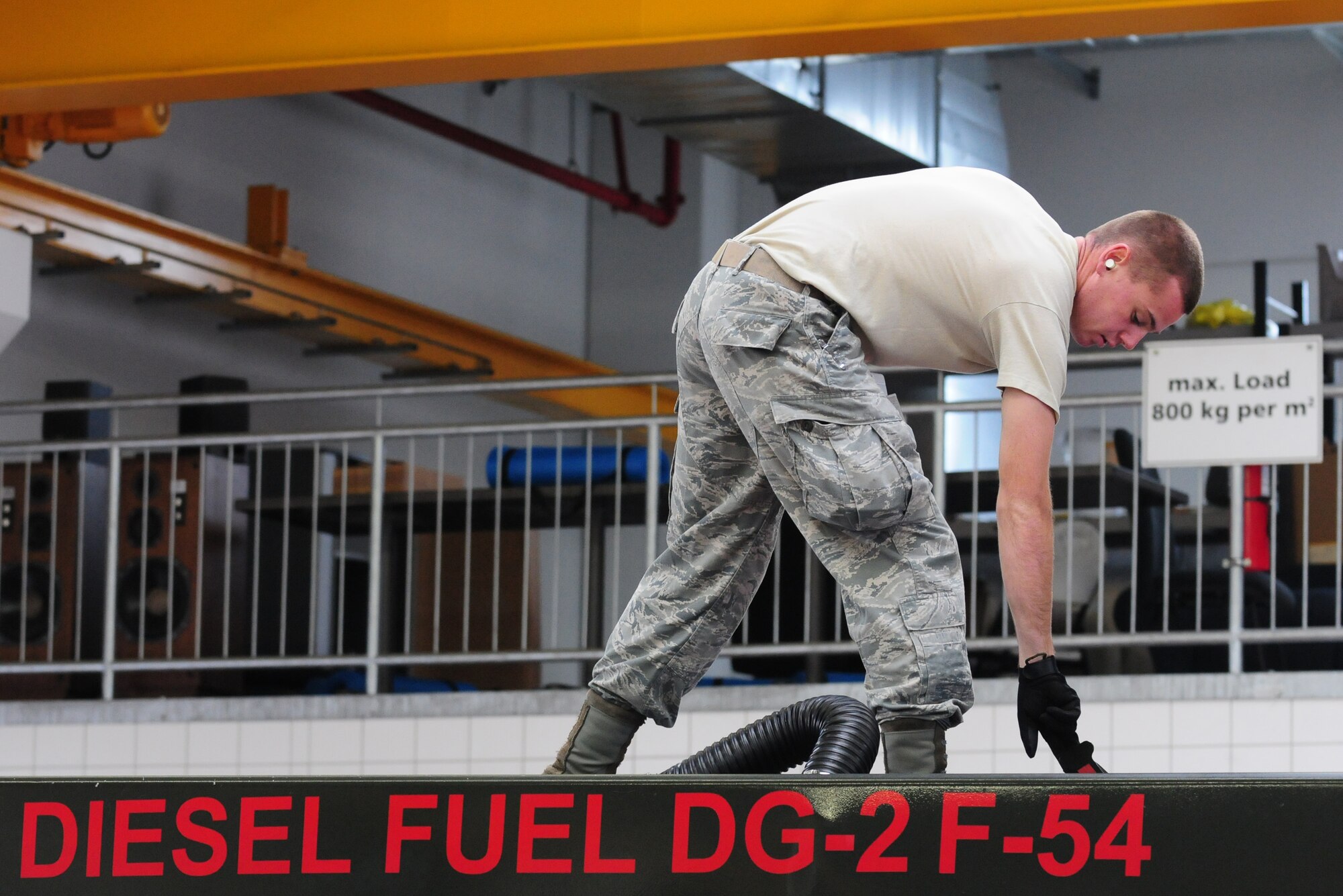SPANGDAHLEM AIR BASE, Germany – Senior Airman Alex Applegate, 52nd Logistics Readiness Squadron fuels journeyman, performs an inspection on an R-11 6,000 gallon refueler here Aug. 9. The fuel is tested to check for contaminants and monitor the amounts of additives and water in the fuel as part of a monthly inspection. The LRS fuels maintenance flight provides clean, dry fuels and cryogenic products for the 52nd Fighter Wing. (U.S. Air Force photo/Airman 1st Class Matthew B. Fredericks)
