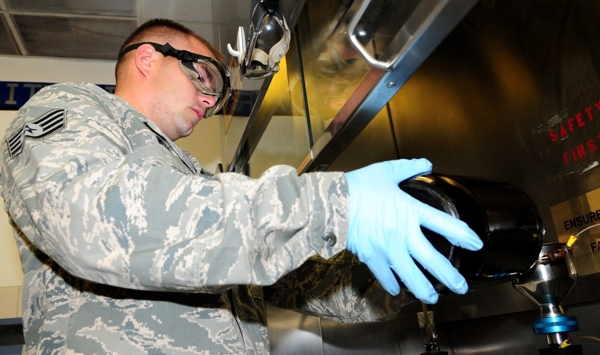 SPANGDAHLEM AIR BASE, Germany – Staff Sgt. Justin Wendt, 52nd Logistics Readiness Squadron fuels lab technician, performs a bottle-method test to determine the solids content of the fuel here Aug. 9. The fuel is tested to check for contaminants and monitor the amounts of additives and water in the fuel as part of a monthly inspection. The LRS fuels maintenance flight provides clean, dry fuels and cryogenic products for the 52nd Fighter Wing. (U.S. Air Force photo/Airman 1st Class Matthew B. Fredericks)