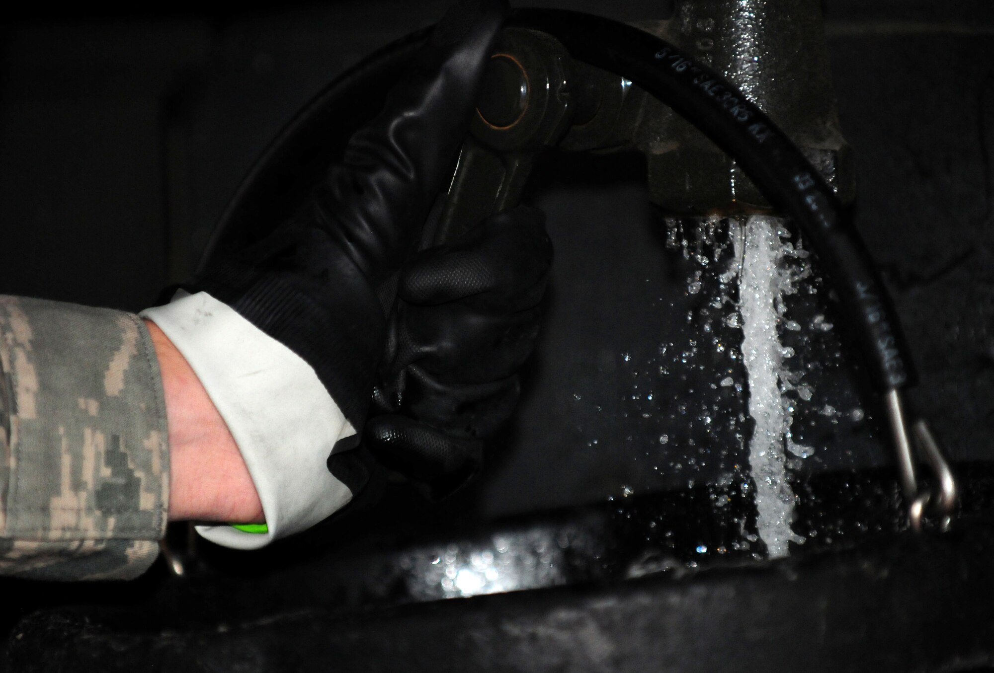 SPANGDAHLEM AIR BASE, Germany – A 52nd Logistics Readiness Squadron Airman collects a sample of fuel for testing here Aug. 9. The fuel is tested to check for contaminants and monitor the amounts of additives and water in the fuel as part of a monthly inspection. The LRS fuels maintenance flight provides clean, dry fuels and cryogenic products for the 52nd Fighter Wing. (U.S. Air Force photo/Airman 1st Class Matthew B. Fredericks)