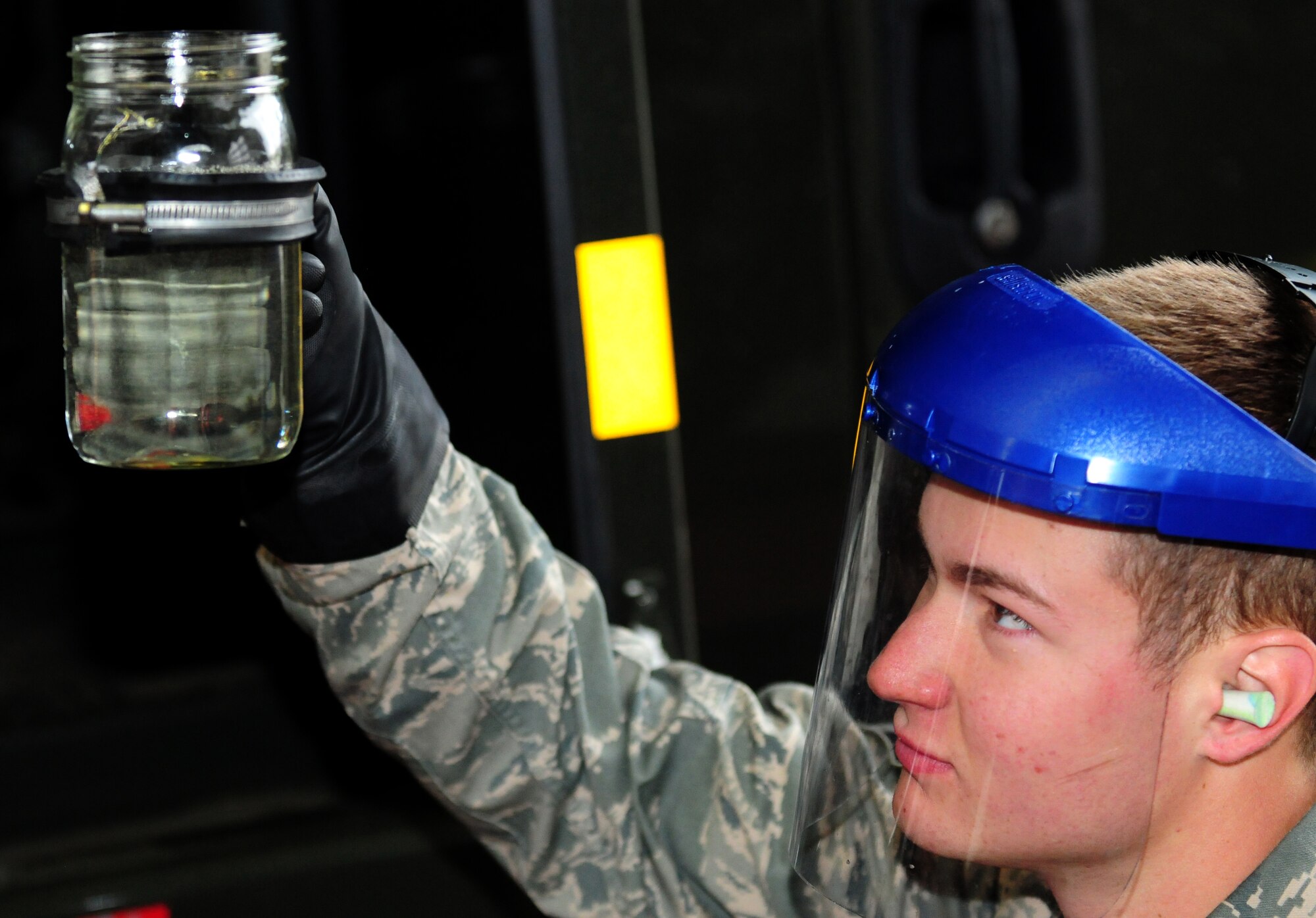 SPANGDAHLEM AIR BASE, Germany – Airman 1st Class Gage McClean-Coyer, 52nd Logistics Readiness Squadron fuels apprentice, collects a sample for testing here Aug. 9. The fuel is tested to check for contaminants and monitor the amounts of additives and water in the fuel as part of a monthly inspection. The LRS fuels maintenance flight provides clean, dry fuels and cryogenic products for the 52nd Fighter Wing. (U.S. Air Force photo/Airman 1st Class Matthew B. Fredericks)
