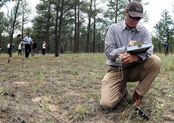 Dr. Jeff Blythe catalogs a find at an archeological site on the Air Force Academy during a Native American consultation June 9, 2010. Blythe is a representative of the Jicarilla Apache Tribe, one of 14 tribes invited to a second consultation Aug. 9-11, 2011. (U.S. Air Force photo/Johnny Wilson)