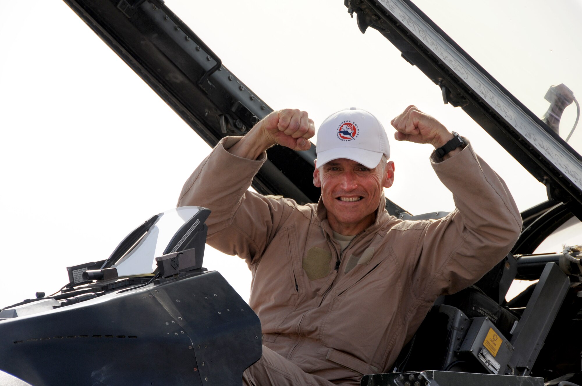 Brig. Gen. Kurt Neubauer, 332nd Air Expeditionary Wing commander, celebrates
surpassing the 4,000th flying hour mark in the F-16 "Fighting Falcon"
aircraft. Neubauer was greeted by Joint Base Balad, Iraq, personnel to
celebrate the event. (U.S. Air Force photo by Senior Airman Jeffrey
Schultze)  
